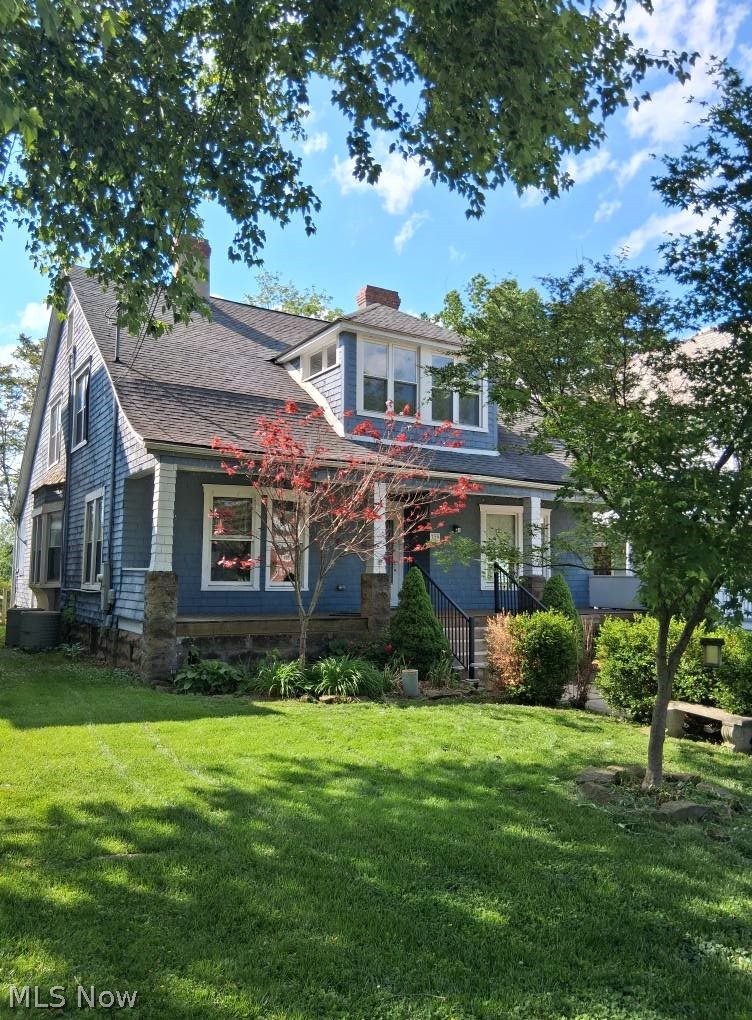A charming spacious colonial featuring hardwood floors, large rooms, original doors and built ins, fireplaces and a quaint pass through in dining room to kitchen. The house is situated close to high school, grocery and gas stations, and sits between Devola and Marietta downtown area. You could be a bicycle ride to many amenities. This home needs someone to appreciate its potential of grandeur, as it does need some repairs but is painted in lovely colors and move in ready.  It needs some design know how for the  4 large closet spaces ( approximately 7 x 12 and 7  x 18) for the large bedrooms . There is a center bonus room on 2nd floor with doors that could be used as a office or common space for upstairs and an upstairs sunporch /sitting room could also be used as a bedroom. Even the full baths are spacious. Furnace is one year old, electric updated in 2017 and all new windows in 2016.   With a large front porch to greet the morning sun and have coffee  and an enclosed porch and outside deck and riverview patio at back of house there is so much outdoor space every one in the family can have a favorite reading spot! Add  some patio stairs to get to your rivers edge.   This driveway is being shared by neighbor but has 2  parking spots in front and space in the back by detached garage.