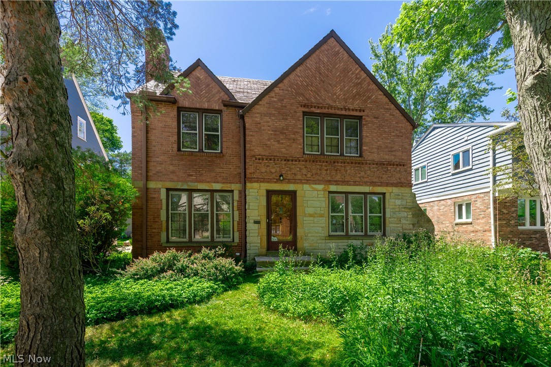 Welcome to this stately brick Colonial nestled on a quiet, tree-lined street. Through the front door, you are greeted by a spacious formal living room featuring a fireplace and beautiful wood floors. On the opposite side of the vestibule is the large formal dining room, perfect for gatherings and special occasions. As you move toward the back of the home, you'll pass through the charming breakfast room, complete with a bay window, built-in china cabinet, and silver-foiled ceiling. The kitchen offers solid-surface countertops and abundant storage. Beyond the kitchen is the inviting family room, which provides access to both the back patio and the loft above. Completing the main level is a private office with wood-paneled walls and built-in bookcases, along with a convenient powder room for guests. At the top of the main staircase, you'll find a second access point to the loft. Used by the current owner as an art studio for many years, this versatile space offers endless possibilities, whether you envision a creative studio, home office, playroom, or additional living area. The spacious primary suite features dual closets, a window seat, a vanity area, and an en-suite bath. Two additional bedrooms and a full guest bath complete the second floor. The third floor offers another guest bedroom, a third full bath, and ample storage, including a cedar closet. The expansive lower-level rec room provides even more flexible living space. Whether you need a second family room, playroom, home gym, media room, or a combination of uses, there is plenty of room to make it your own. Outside is a private backyard oasis, highlighted by a pergola draped with mature vines—an ideal setting for relaxing or entertaining. Conveniently located just minutes from shopping, dining, entertainment, hospitals, and universities.