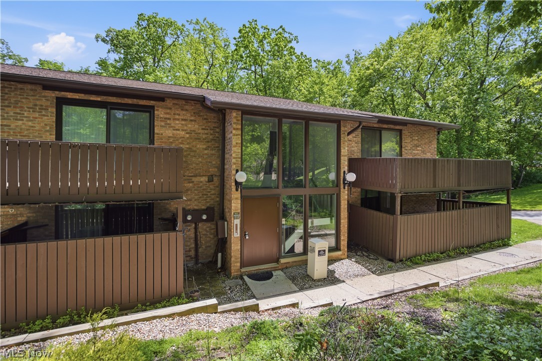 Welcome Home to effortless living in the heart of Brecksville in The Woods! Step into this beautifully maintained end-unit condo that truly has it all! Tucked away on the first level, this rare find welcomes you with a wrap-around porch surrounded by privacy fencing — your own private outdoor retreat right at the front door. The freshly carpeted entryway leads you to one of this home's standout features: a rare, attached 2-car garage is located in the lower level, plus a large dedicated storage room nearby for all your extras. No more hunting for space — it's already here!

Inside, the spacious, open-concept living area flows into the dining room and galley kitchen, creating a bright and inviting space for everyday living and entertaining. Two sets of sliding doors open to the private, wrap-around patio blending indoor comfort with outdoor relaxation. And here's a unique bonus: the concrete walls between condos keep things quiet and peaceful, so you can truly unwind at home.

The galley kitchen comes equipped with appliances and connects to a convenient laundry room with washer and dryer included. The primary suite is generously sized with **two, walk-in closets**, a built-in vanity, and an attached half bath. The second bedroom is equally spacious with its own walk-in closet. The full bath features a tub/shower combination and ceramic tile.

Recent updates for peace of mind include - Hot Water Tank (2025), HVAC rebuilt (2020), roof less than 10 years old as well as a new garbage disposal. Enjoy the ease of condo living without sacrificing space, privacy, or convenience — all in the heart of sought-after Brecksville. With its rare combination of a private patio, 2-car garage, and quiet end-unit setting, this home checks many boxes. Schedule your private showing today and make this Brecksville gem your next home!