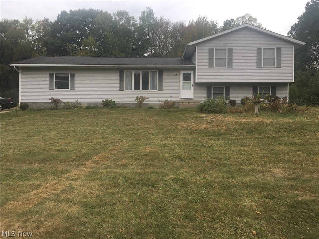This 1994 four-level split is worth taking a look.  Offering 2048 square feet of finished living space, 3 bedroom, 2.5 bathrooms, 9x15 lower bonus room, large eat-in kitchen, living room, and comfortable family room with beautiful stone fireplace.  Located in Rootstown School System with Ravenna mailing address not too far from major highways (between Rt 44 and Rt 43).  Attached 2 1/2 car garage with water.  Good storage areas and closets, electric heat, movable kitchen wood block remains, master has own private full bath are nice features.  Plenty of room to roam inside and out on lovely 1.71 acres on quiet country dead-end road. Great quiet location!  Immediate possession offered.  Nice gardening yard too. (See broker remarks)