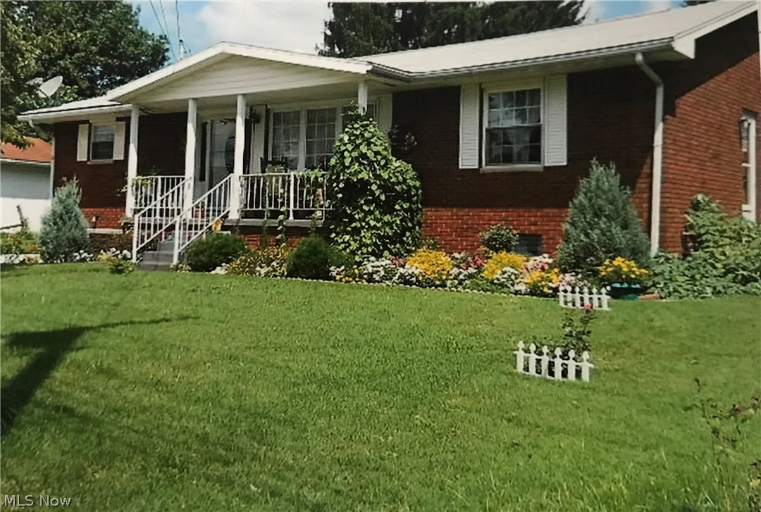 Beautiful all brick home. Very well maintained throughout. Oak trim & doors plus hardwood floors in all 3 bedrooms. Master BR is hardwood beneath neutral plush carpet. The one and half baths on main floor have been extensively remodeled. Spacious eat in kitchen with counter-tops & full compliment of appliances. Huge living room/dining room combination. The basement family room has a wood burning Fireplace plumbed for gas logs and end wall of built-in shelves.Whole  house fan. In 2010 Lennox High efficiency furnace & C/A installed. Flat backyard with 12x15 screened patio.