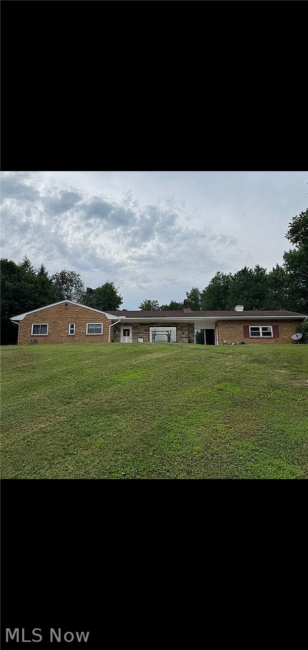 Motivated Sellers!!!!! Beautiful 2,500 sq foot brick home.  This well maintained home offers 3 bedrooms , 2 1/2  bathrooms with a spacious living room\dining room combo. Walk down the unique spiral staircase to the finished basement featuring a large open rec room with a wet bar, pool table, spacious bathroom, and bonus room used as a 4th bedroom. Perfect for extended family, guests or just additional living space. Step outside to a quiet 2 acre lot with a stunning oversized yard, a nice garage, and a gorgeous man-made pond that creates a peaceful backyard retreat. With plenty of indoor and outdoor space to enjoy, this home makes it easy for entertaining and combines comfort, functionality, and charm all into one! Be ready to host family holidays because this is a home your family/friends are going to want to be at!