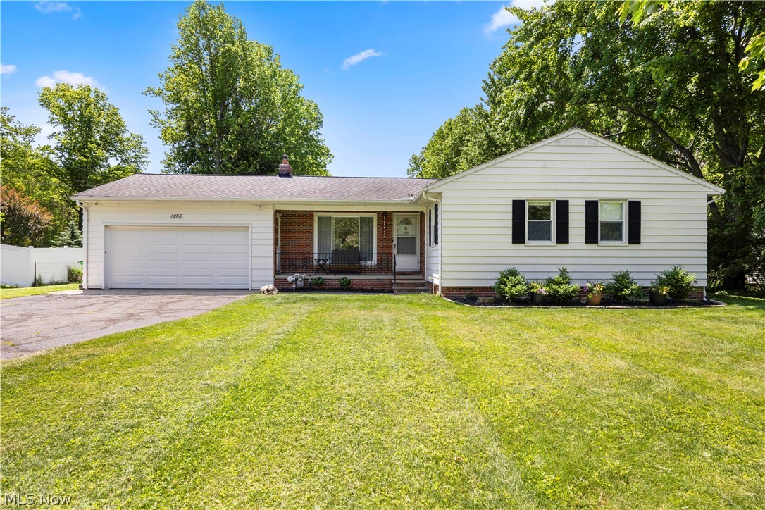 Welcome HOME to 6052 Highland Rd. in beautiful Highland Heights, Ohio! This charming 3-bedroom ranch offers the perfect blend of modern convenience, thoughtful updates and peaceful outdoor living. Step inside to discover a fully integrated smart home where you can control nearly everything right from your phone. The three bedrooms feature original hardwood flooring, while the remainder of the main level boasts newer luxury vinyl plank flooring for a stylish and low-maintenance finish. The home has been extensively updated with a newer furnace, central air conditioning, water heater, windows, entry doors, garage door and opener, lighting throughout, electrical panel, electric fireplace with mantel, and newer kitchen and laundry appliances, providing peace of mind for years to come.

The full, dry basement offers additional living space with a partially finished layout and newer glass block windows. Outside, you'll find an attached 2-car garage and a spectacular 1.5+ acre lot that offers endless possibilities. The partially fenced property features a concrete patio, fruit trees, wooded areas with walking trails and a relaxing fire pit area, perfect for entertaining or enjoying nature. An outbuilding equipped with electricity and a solar generator provides flexible space that can serve as a workshop, storage shed or even a third garage. Conveniently located with easy access to major highways and just minutes from shopping, dining, and everyday amenities, this move-in-ready property delivers the best of country-like living with city conveniences nearby. All appliances stay so all you have to do is MOVE IN!!