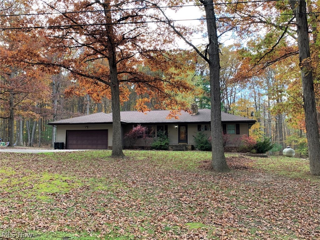 Find your paradise in the scenic 3 bedroom, 1.5 bath ranch-style home situated on a one acre lot just a stone's throw away from Berlin Lake and the public boat launch. Offering up a walk-out basement, backyard swimming pool & hot tub, and a nice 24 x 40 outbuilding with concrete floor and three large bays to store your ATV's, Sea-Doo's, toys, and lawn equipment. The oversized driveway has room to park your boat. Inside the home you'll find a living room with fireplace, custom kitchen, dining area with slider to the deck, office, and a partially-finished basement with fireplace. Located in the desirable Southeast local school district.