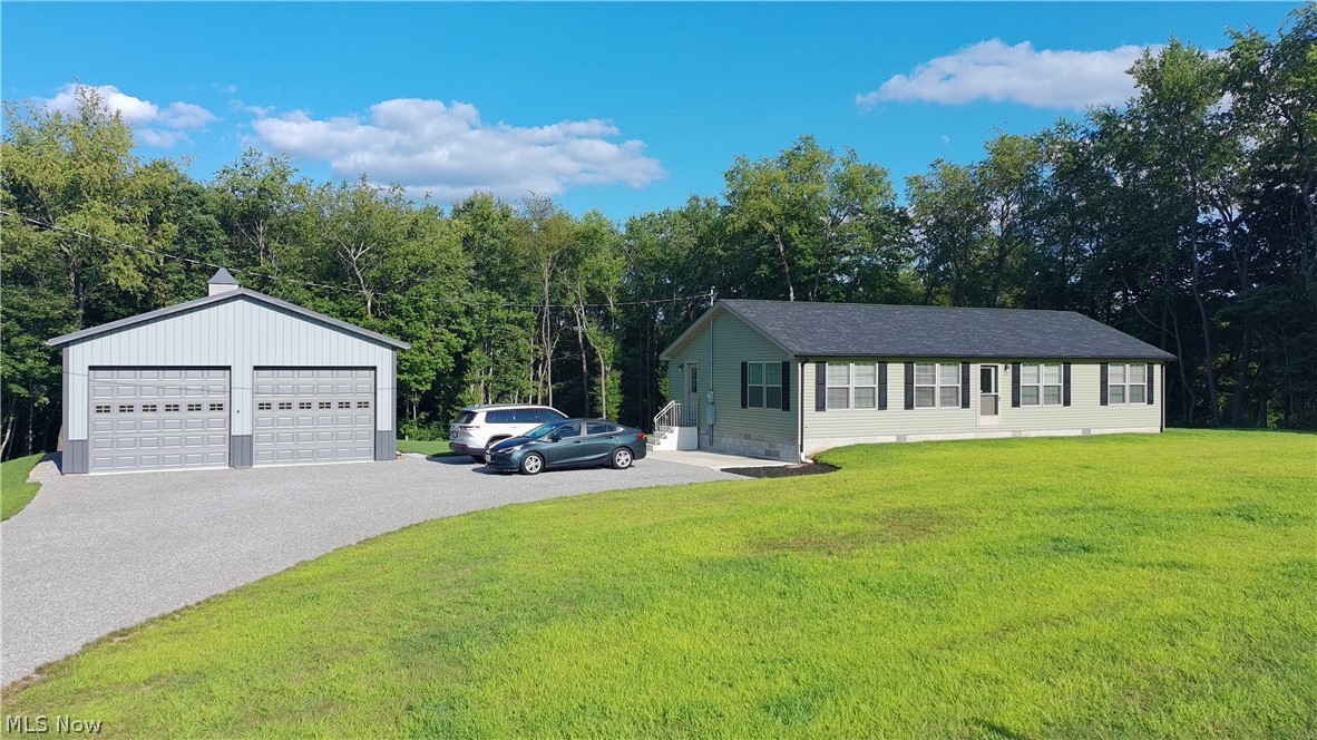 Welcome Home to 13542 Old Fredericktown Road.  If you enjoy wildlife in its natural habitat, this is the place for you!  Begin the stroll down the private gravel drive to your own personal country retreat! Everything you see was designed and set approximately 1.5 years ago. Septic was newly installed in 2024 by Coppock Excavating.  Home and Garage are all new in October 2024. HVAC, HWT, Roof, Appliances, and all major purchases are all new in 2024. Home sits on solid concrete pad and block foundation with 6 vents integrated  for proper ventilation.  Inside, you are welcomed with high-end flooring, floor to ceiling built in cabinets, custom kitchen cabinets, premium solid drywalls and vaulted ceilings throughout the home. The Master Suite includes a walk-in closet and private bath boasting double sinks and a walk-in shower! The 30x40 garage comes complete with a metal roof, concrete floors, and its own 200 amp service. Garage doors measure 10ft high by 12 ft wide. The additional shed is 10x16 with its own work bench. Don't miss out on this private oasis!