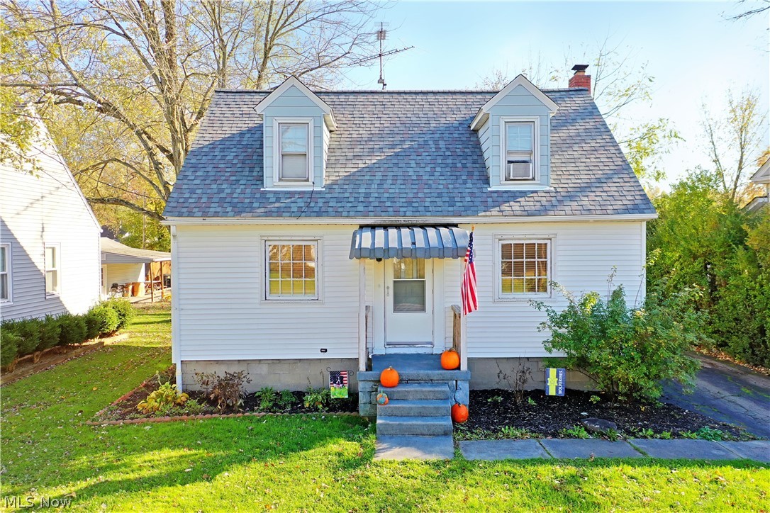 Hurry in to take advantage of this cozy three-bedroom Warren home, offering tastefully updated living space and a finished basement! Tastefully landscaped and waiting under the shade of the nearby trees, the home offers a unique location placed minutes away from local shopping districts and attractions. A covered front patio leads you in to find a spacious living room where dark, hardwood style flooring pairs with sculpted plaster archways, where the central dining room awaits nearby along with the carpeted main stairway. Just around the corner, the updated kitchen delights with its bright white cabinetry and stainless appliances paired with marble look countertops. The ash-colored flooring continues down the main hall where built in cabinets join a lovely first floor full bath. The bath has been recently been updated with new flooring, vanity, and tub/shower surround. A large first floor bedroom sits at halls end with an inviting layout and private closet. Upstairs, additional built-i