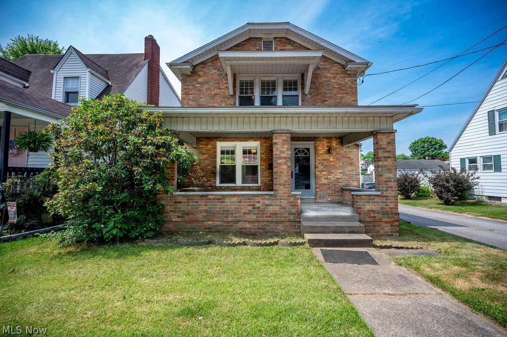 This brick charmer is freshly polished and ready for you to move in!  Located on a corner lot in a convenient downtown location, you'll appreciate this home from the moment you step onto the inviting front porch.  Once inside, the newly refinished hardwood floors, arched openings, and fireplace immediately captivate.  An abundance of natural light fills this home, as you continue through the dining room into the kitchen.  Soft close cabinetry, fresh colors, and a space for a breakfast table make this kitchen great.  The back of the first floor features a newly carpeted family room with fireplace, first floor laundry space, and a 3/4 bath.  Just through the sliders, a large screened porch with skylights extend your living space even further.  Upstairs, there are three newly carpeted bedrooms and a full bath.  Don't miss out on owning this solid home with both historic charm and modern amenities.