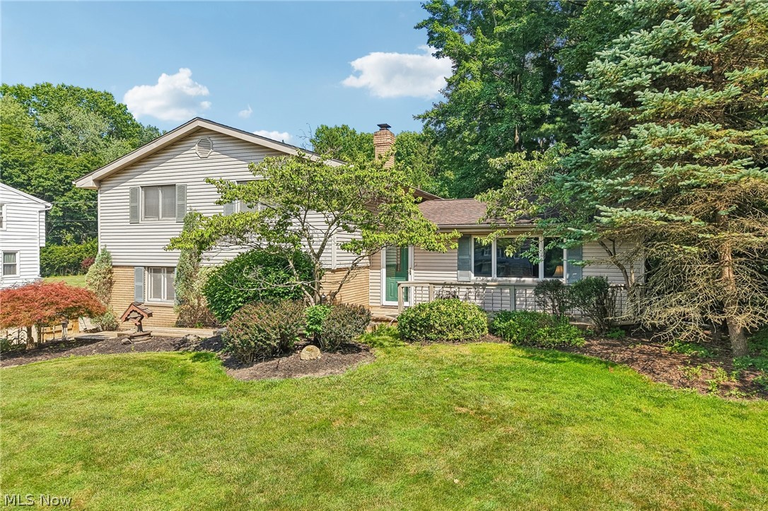 Welcome to 8127 Rolling Brook Rd, a charming home nestled in the desirable Sagamore Hills township. This well-maintained four-bedroom, two-bathroom residence radiates warmth and readiness for its new owners. With a gorgeous curb appeal and throughtfu landscaping, this split-level gem is set back from the road, featuring an extra-wide driveway and a two-car attached garage, perfect for modern families. The open floor plan is ideal for entertaining, seamlessly connecting bright and inviting living spaces filled with natural light. On the upper level, discover four spacious bedrooms, each with ample closet space, including a primary suite with a private bathroom. The cozy lower level offers a family room with a gas fireplace and sliding glass doors leading to a covered patio, perfect for relaxation. The expansive backyard provides abundant space for outdoor activities, making it an ideal retreat for those who love to entertain or enjoy nature. This home is conveniently located near shopping, dining, and entertainment, ensuring you have everything you need close by. Don’t miss the chance to own a property that combines comfort, convenience, and charm.