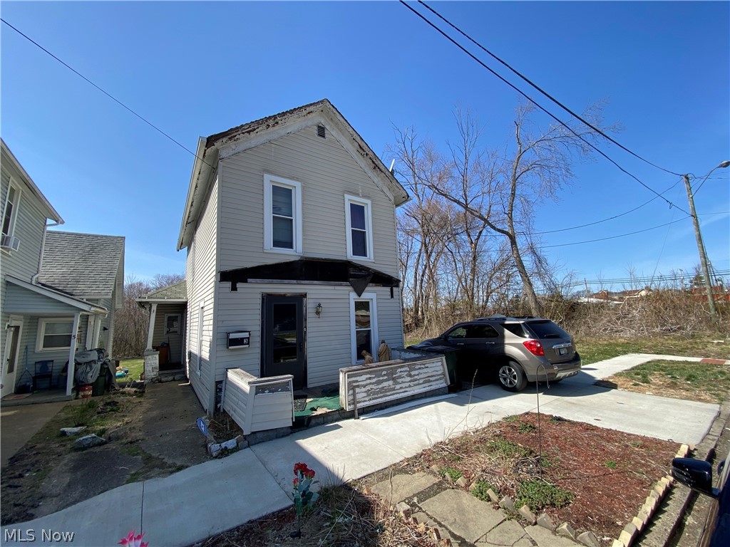 2 bedroom, vinyl sided home.  Oak kitchen.  First floor den.  Replacement windows throughout.  At this price, why pay rent?  Includes 2 parcels....double lot.  Exclude range and refrigerator.