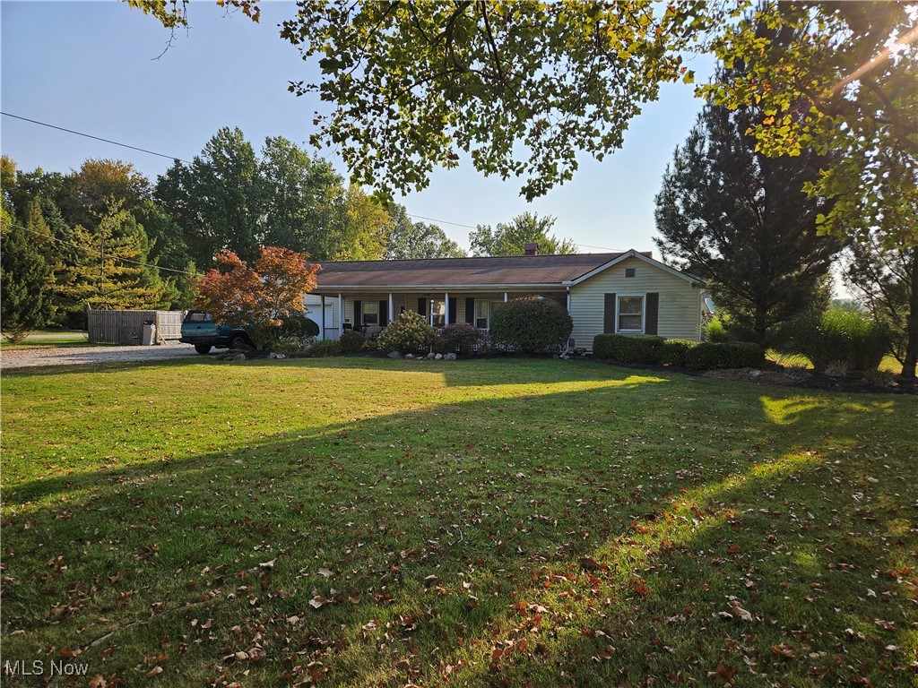 Spacious 3-bedroom Ranch situated on a beautiful 2-acre lot with 150’ of frontage, with two large outbuildings. The kitchen has oak cabinets that flow through to the dining room, and a spacious living room with plenty of natural light.  The 55x40 building is heated, insulated, has concrete flooring, and offers 100 AMP/220 service. The larger building is 88x42 and features three sliding doors and an overhead door, with a 14-foot clearance, providing plenty of room for expansion. Commercial zoning.