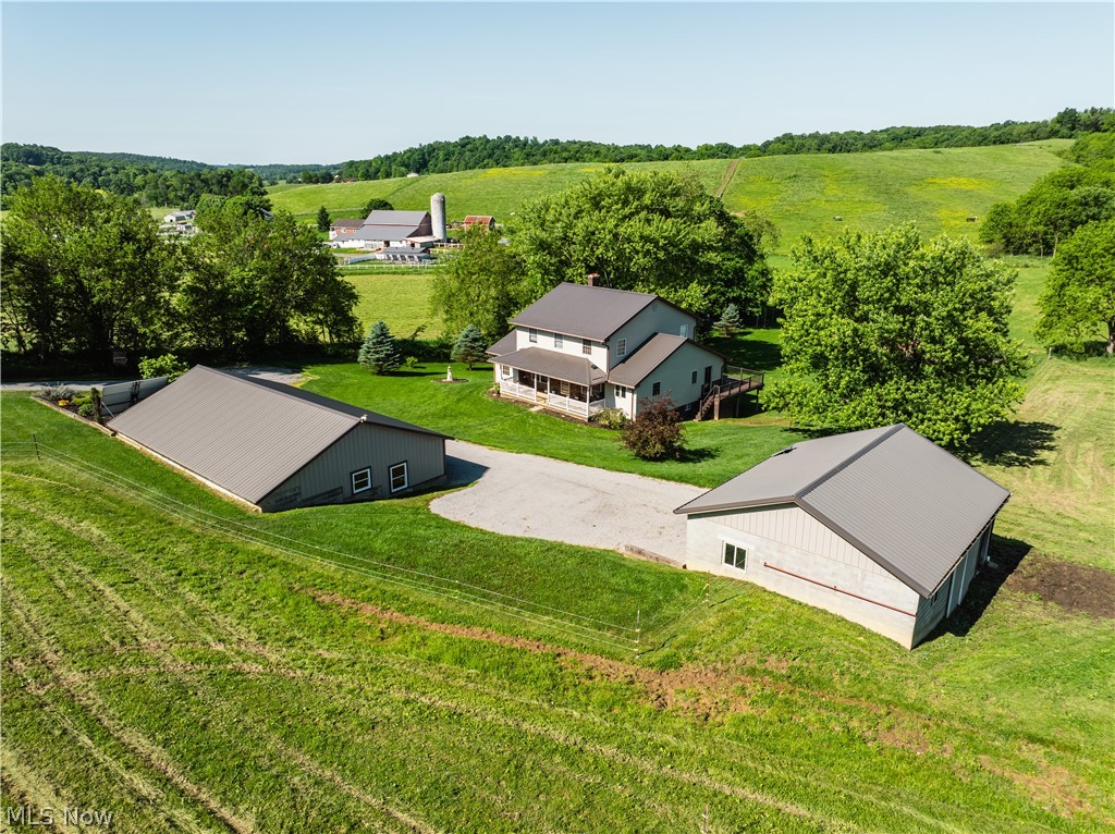 Live Auction 6/30/2026 6:00 PM - Parcel 1: 3.069 Acres w/ 250’ frontage – Includes Improvements - A beautiful, 2-story one-owner home, built in 1998, with excellent updates. The home features large oak kitchen with dining area and pantry, spacious living room with open staircase, 2 bedrooms and full bathroom along with mudroom on the main level. The upstairs includes a large sitting room, 3 bedrooms and a full bath. The full walkout basement has a kitchenette, ½ bath, mechanical room with shower, fruit cellar, laundry area, and storage room. Utilities include private well & septic, natural gas hot water boiler heat with wood burner, natural gas hot water heater, and solar system. The home also features covered front porch, nice deck, and beautiful backyard patio and yard area with gardens and plenty of yard space. The home has a newer roof and deck and is in great condition. The 36’x50’ shop is finished inside along with the plumbing for in floor hot water heat, plumbed for bathroom, and is in excellent condition. The barn is 30’x32’ and is set up for box stalls and hay storage. The land features pasture areas with fencing, natural spring, and a very nice building site. Offered in 2 parcels or in its entirety, this property is a must see in private country setting.