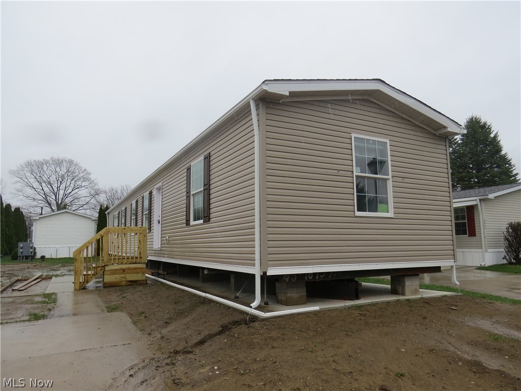 Brand new manufactured home offering 3 bedrooms, 2 full bathrooms, and 1,140 sq ft of comfortable living space. The carpeted primary bedroom features a ceiling fan, walk-in closet, and private bath with walk-in shower. Open concept floor plan. The kitchen is well appointed with two pantry cabinets, an island with sink, and a stainless steel appliance package including electric range, refrigerator, microwave, and dishwasher. Thoughtfully designed layout with modern finishes throughout. Home includes a drape package and 2” mini blinds for added convenience.