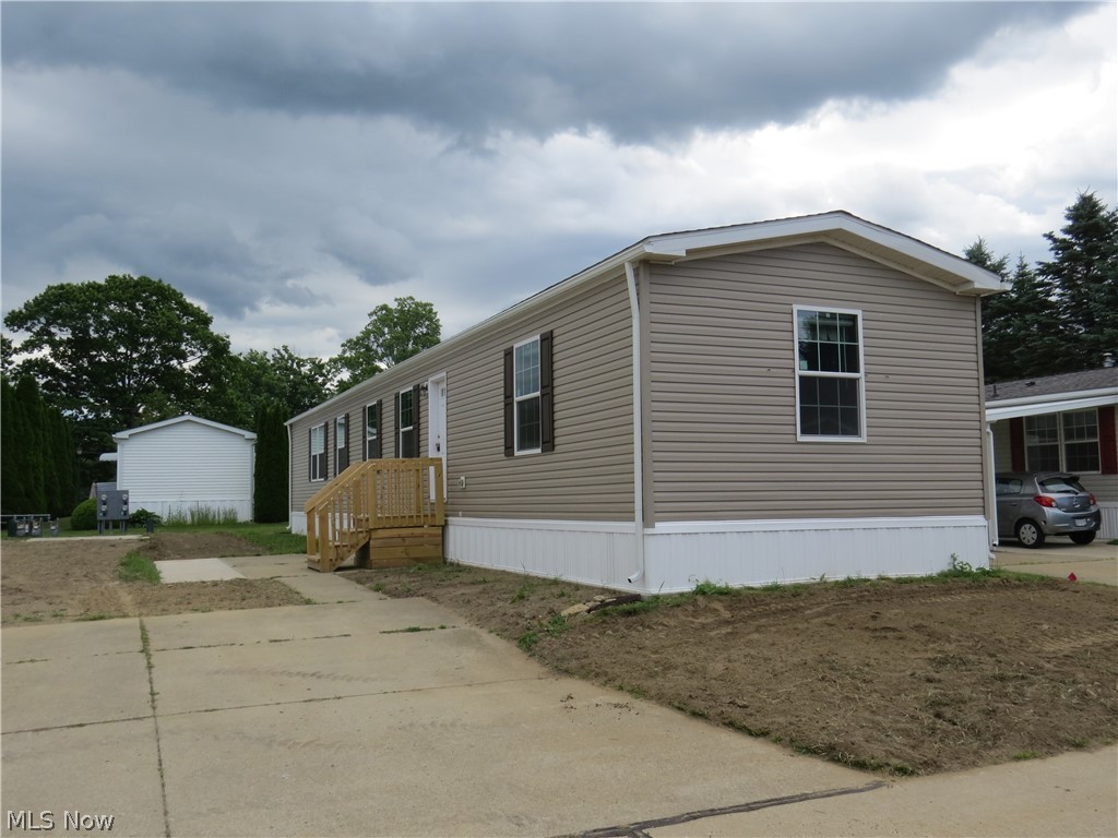 Brand new manufactured home offering 3 bedrooms, 2 full bathrooms, and 1,140 sq ft of comfortable living space. The carpeted primary bedroom features a ceiling fan, walk-in closet, and private bath with walk-in shower. Open concept floor plan. The kitchen is well appointed with two pantry cabinets, an island with sink, and a stainless steel appliance package including electric range, refrigerator, microwave, and dishwasher. Thoughtfully designed layout with modern finishes throughout. Home includes a drape package and 2” mini blinds for added convenience.