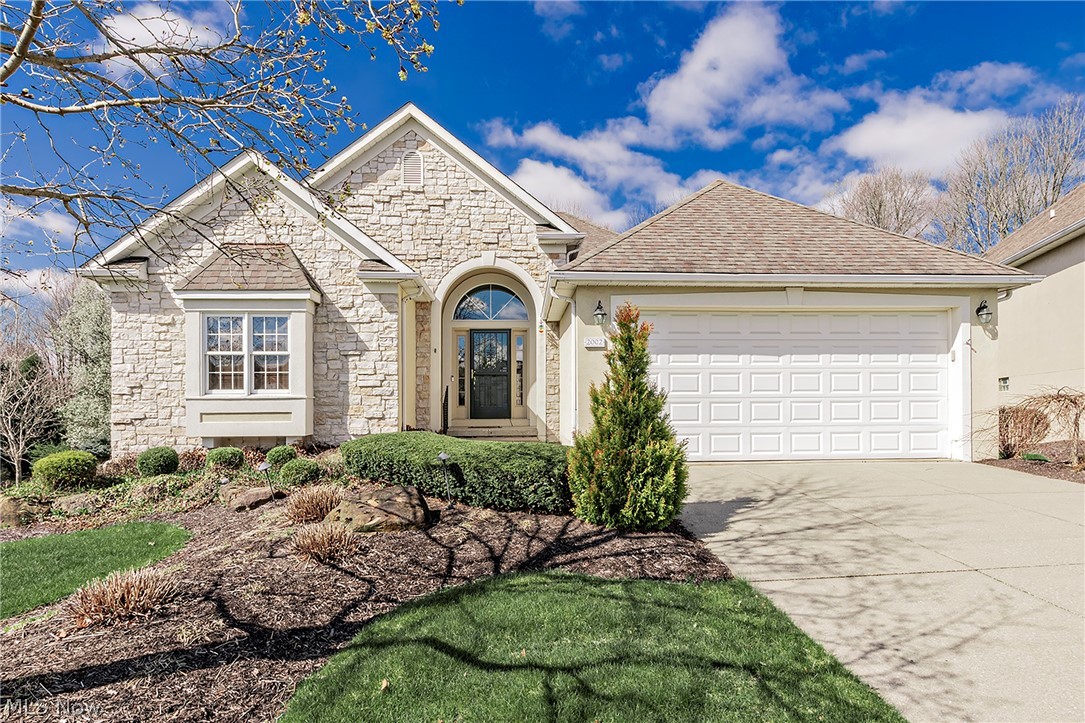A rare and exceptional opportunity awaits at 2002 Fox Trace Trail in The Highlands community of Cuyahoga Falls. This custom-built residence offers five spacious bedrooms and three full baths, highlighted by a spa-inspired primary suite designed for comfort and relaxation. Step inside to discover open, light-filled main level living, where multiple skylights bathe the home in natural light from every angle. The inviting layout flows seamlessly to a walk-out deck overlooking a serene, wooded backdrop, while the sunroom—featuring a stunning cathedral wood plank ceiling—creates a true retreat-like oasis. The oversized eat-in kitchen is ideal for both everyday living and entertaining, offering generous space for gatherings large and small. Thoughtfully designed living areas extend to the finished lower level, accessed by a striking custom spiral wooden staircase. Here you’ll find a second kitchen, three additional bedrooms, and access to a covered walk-out deck—perfect for multi-generational living or guest accommodations. High ceilings continue into the expansive unfinished areas, providing abundant storage or endless possibilities for future customization. Additional highlights include two fireplaces for cozy seasonal enjoyment, convenient main-level laundry, and an attached two-car garage with durable Nature Stone flooring. Enjoy a low-maintenance lifestyle with The Highlands’ HOA handling exterior landscaping and snow removal, allowing more time to appreciate this peaceful setting. Truly a special property, ready to welcome its next fortunate owners.