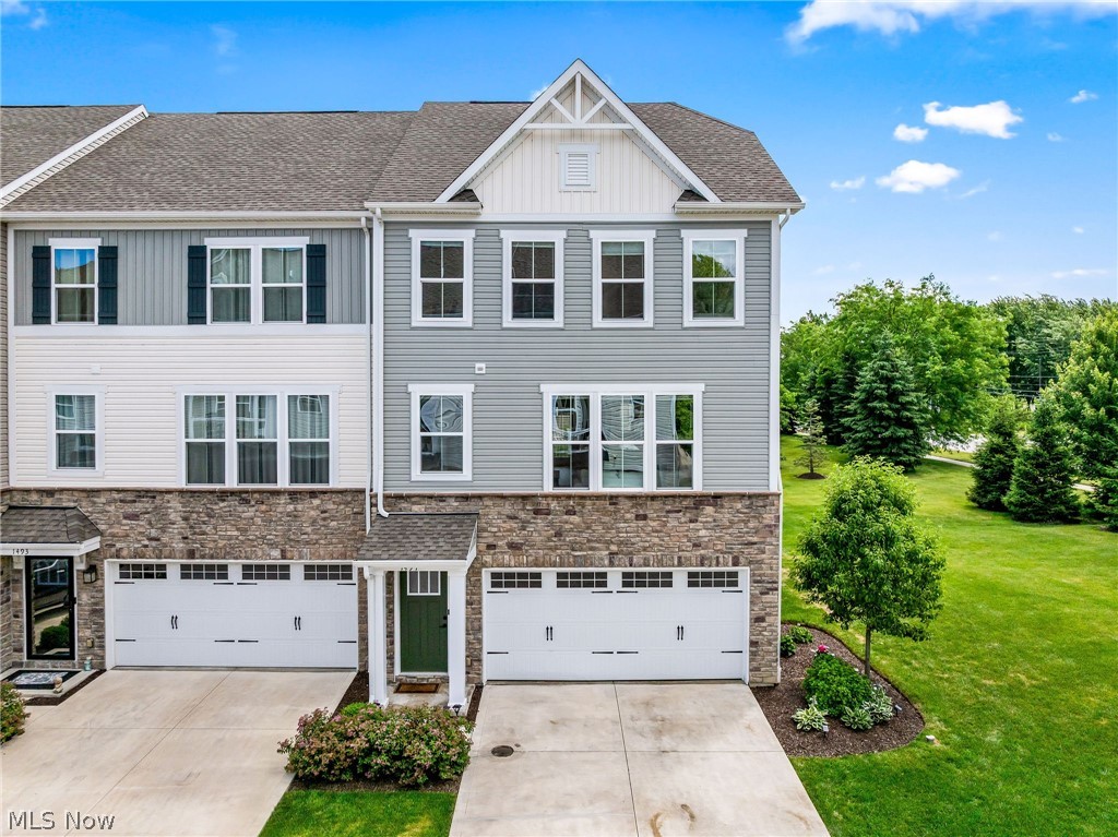 Meticulously maintained end-unit condo built in 2021 in Avon, Ohio's sought-after Concord Village community. This 2,112 sq ft home offers 3 spacious bedrooms and 2.5 baths, a finished lower level and extra natural light that come with an end unit, along with a finished garage providing valuable bonus flex space for a workshop, home gym, or storage, an upgrade you won't find in most units on the street. The open-concept main level flows effortlessly from a bright living area into a well-appointed kitchen with ample cabinetry, generous counter space, and a center island, opening to a dining area perfect for everyday living or entertaining. Upstairs, the primary suite features a private en-suite bath and walk-in closet, alongside two additional bedrooms, a full second bath, and a convenient laundry area. Pride of ownership shows throughout this nearly-new, true turnkey home, with low-maintenance condo living in every corner. Enjoy the largest lot in Concord Village for outdoor enjoyment, gardening, or simply more breathing room, all while still benefiting from an HOA-maintained exterior and grounds. Ideally located minutes from I-90, Avon Commons, French Creek Reservation, and top-rated Avon Local Schools, with easy access to shopping, dining, parks, and downtown Cleveland about 20 miles away. This is quiet, low-maintenance suburban living in one of Avon's premier condo communities, schedule your private showing of 1497 Caymus Ct today before it's gone!