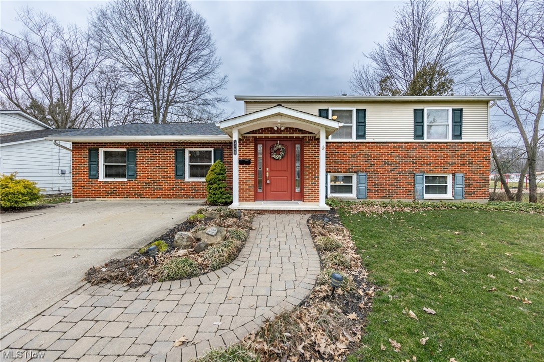 A wonderful, one of a kind 4 bedroom, 2 full bath split level with a walk out lower level in Stow.  This excellent home has an updated, and large eat-in kitchen with granite counter tops and stainless steel appliances.  The large living room is shared with a dining area.  The main level family room is 24x12 with a fireplace.  A master suite has a huge bathroom with a garden tub, shower, and double sinks... and connects to a walk in closet that will shock you.  There are 2 bedrooms on the main level.  A large attached shed is heated as well.  The many updates include a new furnace in 2023, water tank in '22, updated electric panel, and more.  There is a large composite deck off the master, a brick patio, a large yard, and is next to Northport Park.