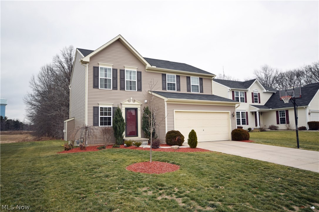 This 2-story colonial-style home, located close to schools, shopping areas, and the highway.  The foyer leads you to a spacious living room with a cozy fireplace.  The kitchen, just off the living room, provides a comforting atmosphere.  The large recreation room, located in the lower floor of the house, is a great place for family time!  Master bedroom has a walk-in closet. What a beautiful deck for relaxation and cook-outs!  Kitchen hutch and basement bar will stay. This home will sell quickly!  Don't miss out - call today to schedule your showing.