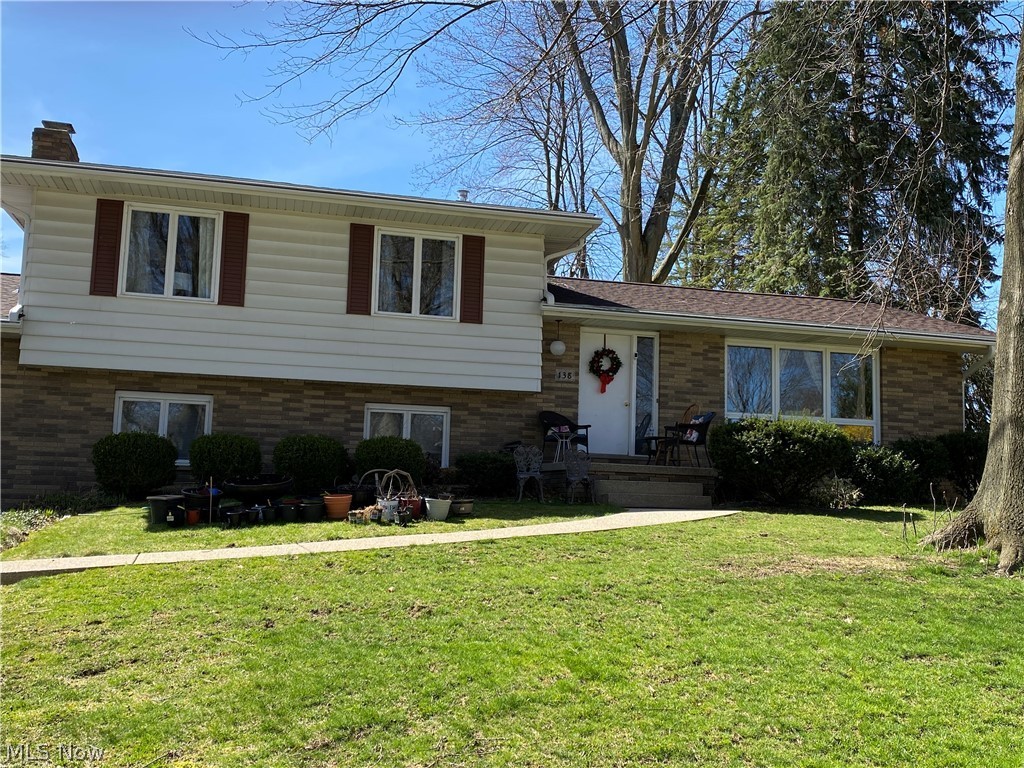 Well-maintained split level in quiet neighborhood. Large living room open to dining room with sliders to enclosed porch, eat-in kitchen.  Upper level has 3 bedrooms and full bathroom.  Lower level has office or possible 4th bedroom with full bathroom, fireplaced family room, mud room to attached 2-car garage.  Unfinished basement with laundry and mechanics.  Private backyard looks over green space and new schools.