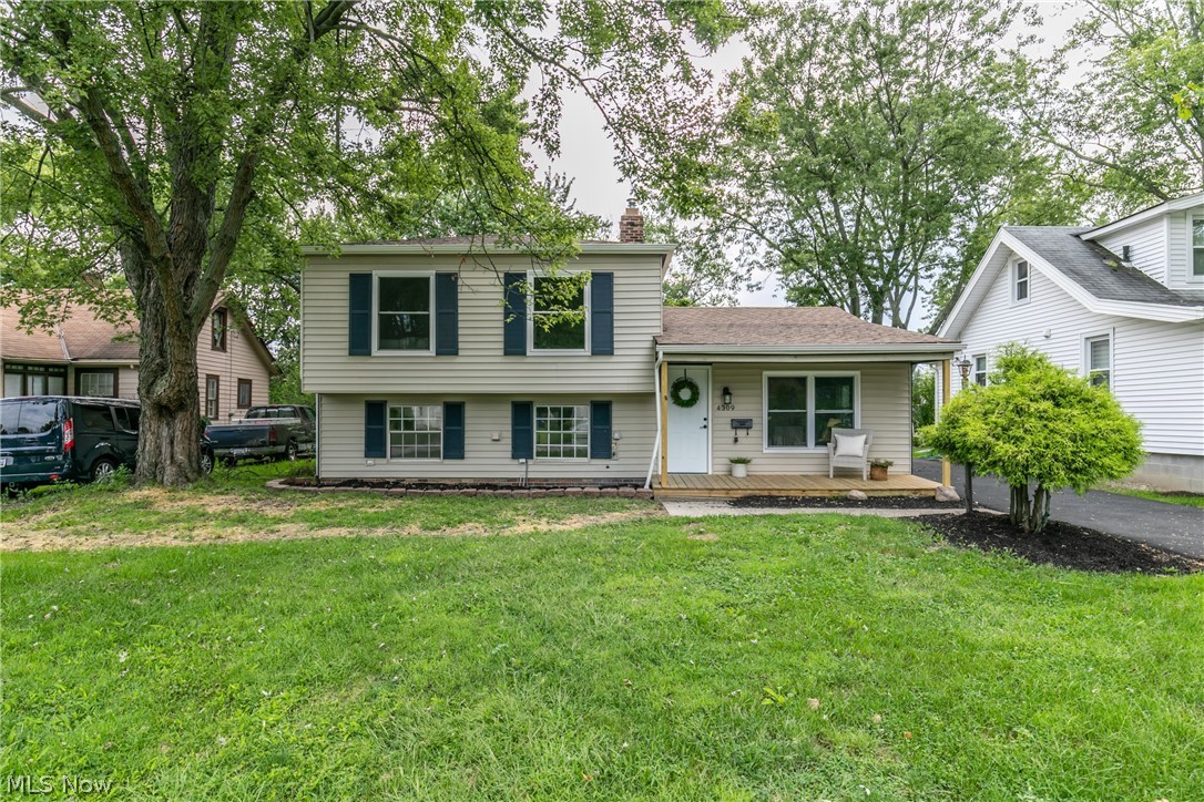 Welcome to this BEAUTIFUL move in ready split level in Fairview Park! This house has been updated and is waiting for you to call your home! Stunning flooring throughout the living, kitchen, and dining area. The living room is spacious with a ton of natural light that opens into the kitchen. The kitchen boosts white cupboards, stainless steel appliances and amazing granite countertops. Off the kitchen is a large dining area with a sliding glass door to the enclosed porch. This area is perfect for entertaining! Down from the kitchen is a lovely little sitting area with  a remarkable whitewashed fireplace. Also the lower level has an updated full bathroom and nicely sized room with an attractive chair rail throughout it. The upstairs has three nicely sized bedrooms with all new carpet. Come check out this home today!
