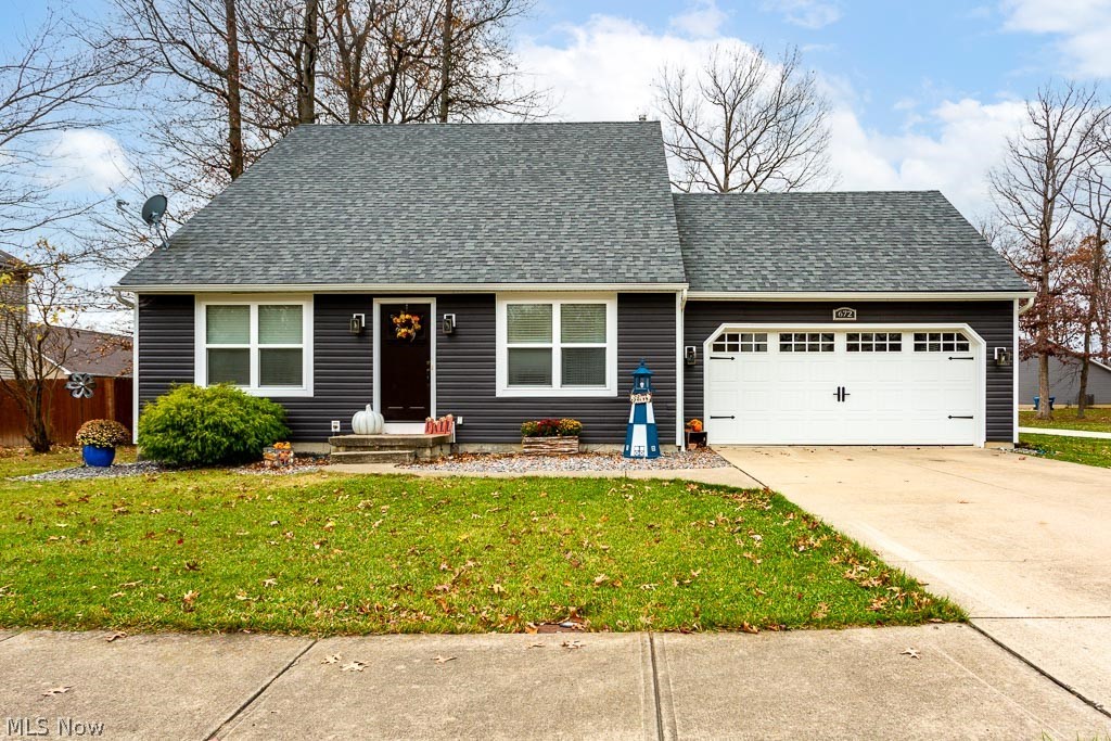 This home is a stunner! Completely remodeled inside and out! There's everything to love about this house! Vaulted ceilings, first floor master bedroom, wooded views, finished basement, 3-4 bedrooms, and giant privacy fenced yard. Enter the home into the Great Room that boasts a vaulted ceiling, new luxury vinyl plank floors, and suspended ceiling fan. The views of the custom kitchen and dining area pull you in from here. Gravitate into the large dining area and luxury kitchen with Cherry cabinets from floor to ceiling, quiet close doors, and beautiful quartz countertops. New stainless appliances, recessed lighting, and solid surface floors complete the kitchen. Elegance continues into the humongous first floor master bedroom, with vaulted ceiling, suspended ceiling fan, and spacious walk-in closet. Remodeled full bath on the first floor has tile floors, new vanity, granite countertops, and new fixtures. Mission-style interior doors throughout, give this home an elegant and rich feel. T