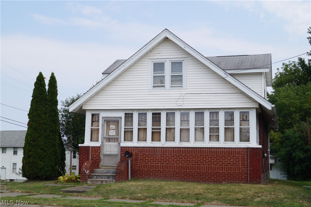 Brick and vinyl Cape-Cod of 3, possible 4,  bedroom home situated on a corner lot.  First floor features a large spacious kitchen, with a functional mudroom and outside door leading to your patio.  Good floor pattern on first  floor offers a full bath, 1 bedroom, large living room with access to a 4 season sun room with closet and built-in book case.  Use you imagination with this heated sun room for additional livable space.   Second floor has 2 carpeted bedrooms with closets and another room which could be used as 4th bedroom (with closet directly across from room) or office/play room; again, use your imagination here too.  Full basement with gas furnace (2017) H/W heater (approx 5 yrs old), electric updated.  2 car detached garage with driveway off of Brady St.with ease to park you car.   Minutes from High School and Elementary School, parks, downtown.  You can walk or ride your bike to Lake Anna.   Owner is offering a Home Warranty as a bonus.