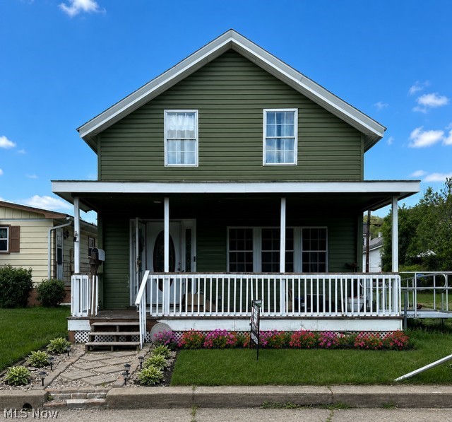 Situated in the highly sought-after Wellsville school district, this impressive two-story home offers three bedrooms, one bathroom, and a spacious living room area that flows effortlessly into a kitchen equipped with ample counter space, refrigerator, stove, and dishwasher. The first floor features a full bath and laundry facilities for added convenience. Three generously sized bedrooms await on the upper level. The expansive backyard, ideal for entertainment, is vinyl fenced and right along the Ohio river. Don't miss this opportunity - schedule your showing today and make this house your dream home, weekend getaway, or your next investment! Sellers are motivated!