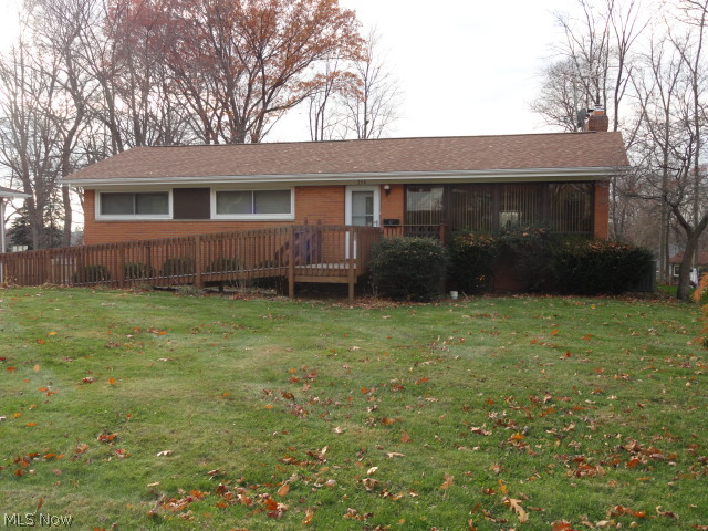 This Brick Ranch with a walkout lower level is situated on an extra deep fenced lot in an area of well maintained homes. 2 Bedroom 2 Bath, originally a 3 Bedroom could easily be converted back. It's Handicap Accessible  if needed. Formal Living room and Dining room with Hardwood Floors. Charming Kitchen with plenty of Wood Cabinets, opens to the Family room with Gas Fireplace. 18 x 15 4-Season Sun room overlooks Big Back Yard. Lower Level Rec Room with Gas Fireplace plus Utility room. Two car Attached Garage. Updated roof, siding, furnace, central air and water heater. Cover Patio too!