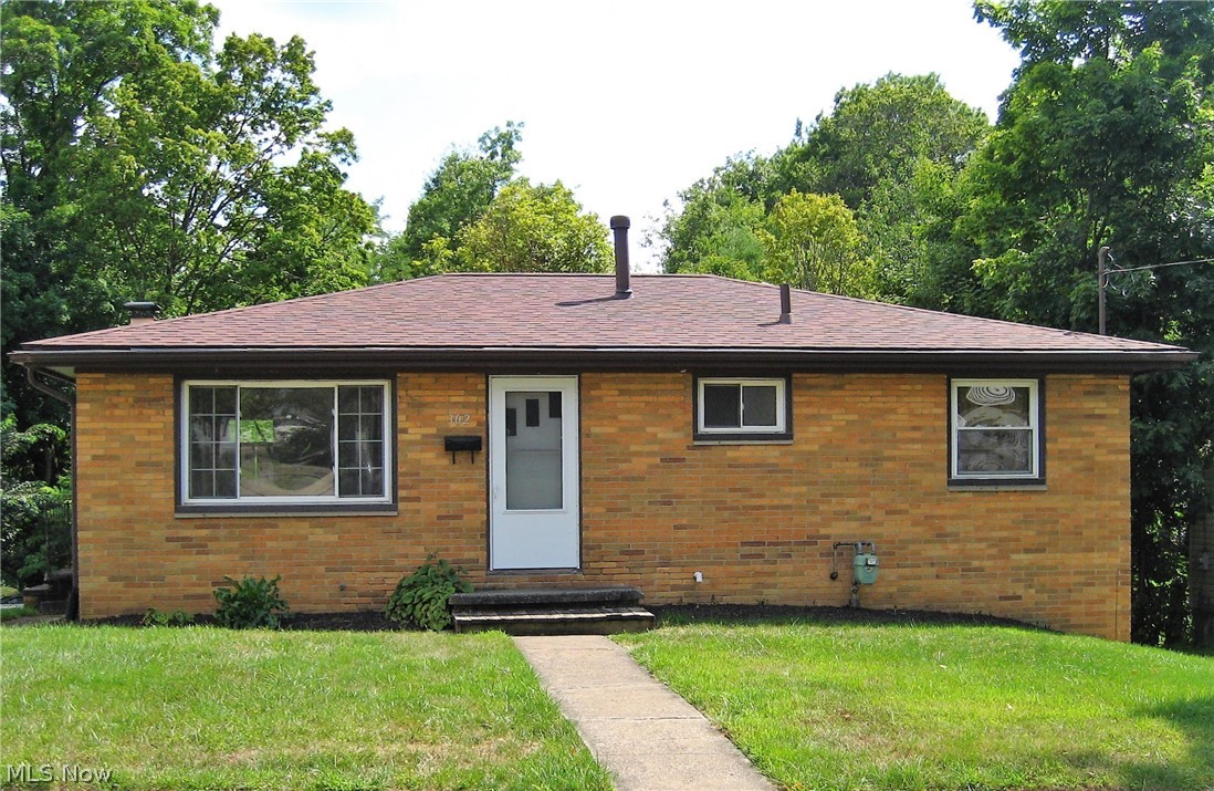 Conveniently located right around the corner from the city schools campus is this 3 bedroom brick ranch. Updates include: new carpet, waterproofing (2020), roof (2019), remodeled bathroom, high efficiency furnace, electric panel, replacement windows, some exterior doors. Hardwood floors in the bedrooms & under the living room/hallway carpeting. Basement is semi-finished with fireplace (never used) and walk-out to patio area.