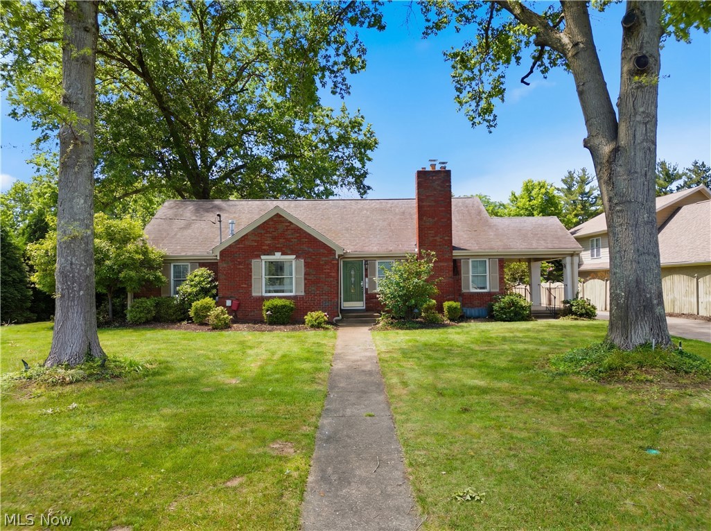 Welcome home to this stunning 3-bedroom, 3-bath brick ranch in the heart of Vienna, conveniently located near shopping, dining, and the Country Club. Offering more space than meets the eye, this home features an expansive floor plan designed for both everyday living and entertaining.

The main level boasts two spacious living areas, both open to the kitchen, creating a seamless flow throughout the home. The rear family room is a showstopper with its cathedral ceiling, numerous windows that flood the space with natural light, and a cozy gas fireplace.

The kitchen features beautiful cream-colored cabinetry, stainless steel appliances, and a gas range, making it both functional and inviting. The primary suite is a true retreat, complete with surround sound speakers, a corner gas fireplace, and a luxurious ensuite bath featuring heated tile floors, a custom walk-in shower with tile, granite, glass, and bronze accents, double vanities, a private water closet, and a spacious walk-in closet.

Additional custom touches throughout the home include crown molding, hardwood and tile flooring, and neutral carpeting. The finished lower level offers incredible flexibility with a large family room, rec/wine room, laundry room, full bath, two kitchenette areas, and a bonus room, ideal for guests, multi-generational living, hobbies, or entertaining.

Upstairs, you'll find a generously sized third bedroom with a large walk-in closet. Outdoor living is equally impressive with a covered side porch and a beautiful stone patio, providing plenty of space for relaxing or hosting gatherings. Completing the property is a detached two-car garage.

This exceptional home combines comfort, character, and versatility in one of Vienna's most desirable locations.