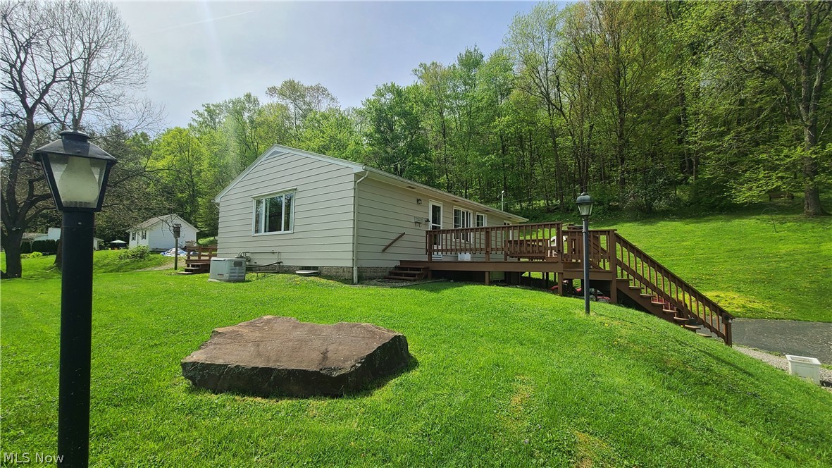 IMMEDIATE POSSESSION AVAILABLE! Priced right and ready for new owners, this solid raised ranch home is on 2.16 acres close to Roscoe Village and Coshocton City Limits. The property entails 3 bedrooms and 1 bath--located in Riverview School District with an attached oversized one car garage and a great view overlooking the fantastic neighborhood. This home has only had one owner live in the property since it was built in 1960. The home has city water, septic, electric baseboard heat, a full house Generac Generator with a Columbia Gas connection (that will convey to the new owners). The owners had the kitchen and bathroom updated within the past 10 years. The exterior of the home, deck and porch have all been repainted within the past 12 months. Sellers believe the home has hardwood throughout (as seen in closet of spare bedroom). The full, unfinished, walkout basement has the laundry connections. All contents in the home on the day of closing will convey to the new owners. Home will con