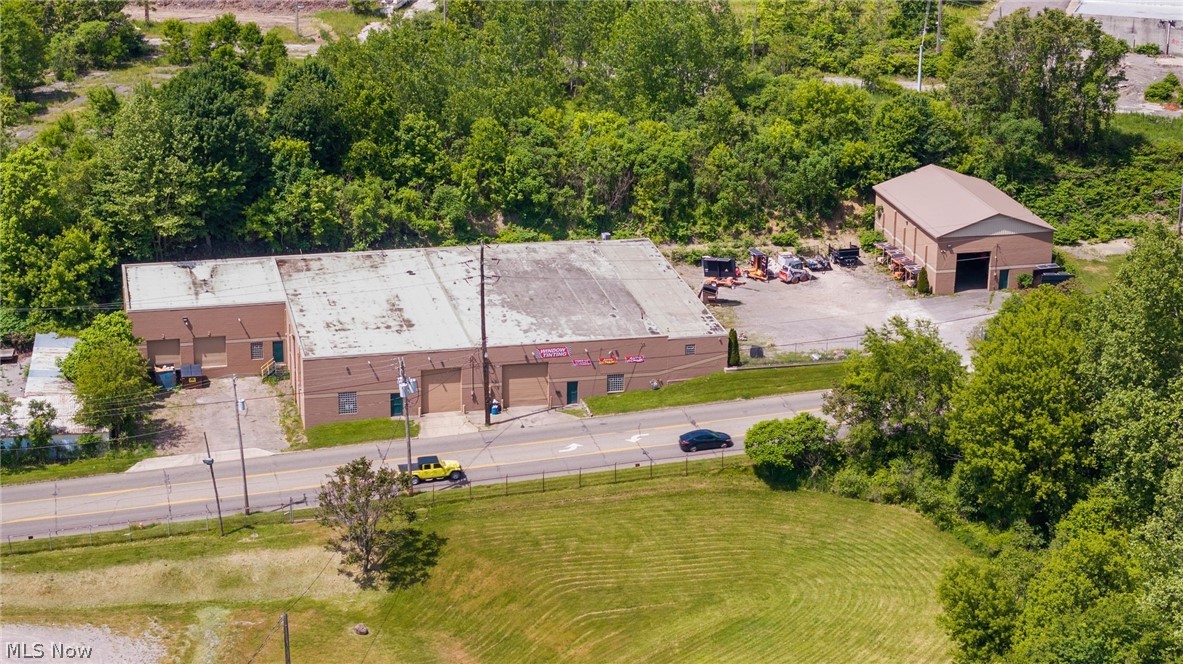 Exceptional Opportunity to own a well maintained and highly versatile commercial property offering 17,604 Sq Ft. of warehouse, light manufacturing and industrial space, including 1900 Sq Ft of finished office space on the upper level of building 1. The property consists of two buildings situated on on a fully fenced site, providing ample security, flexibility, and plenty of space for parking between the two buildings. This immaculate facility features 18 -ft ceilings, 14 ft. overhead doors with docking area, and two commercial cranes in the big building and 1 manual crane in building two. Building two is 2400 sq. ft. Additional equipment will remain with the property. There are 3 bathrooms throughout. Currently occupied by a successful commercial painting company, with additional tenants utilizing space for auto detailing and vehicle storage and equipment. Showcasing some of the versatile uses of this property.