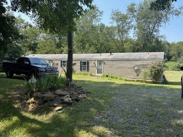 1997 Large single wide Schultz trailer. 14x80. 3 bedrooms and 2 full baths. Very spacious with several updates. 2022 had the well all redone with a new holding tank and pump, propane heat, new flooring in kitchen, Master bedroom and laundry. 2024 was a new electric hot water tank and new carpet in living room and hall. 5 acres of beautiful laying land that goes out back to a running creek. Septic is approx. 20 yrs old. There is an older trailer on the property that has been used as a storage shed for years. Such a beautiful spot with room to build your dream home later if desired.  Mineral rights will transfer with this property! Cash buyers only. Property has never been deeded real estate. Seller pays $466.08 for property taxes and $102.36 for the trailer tax each year.