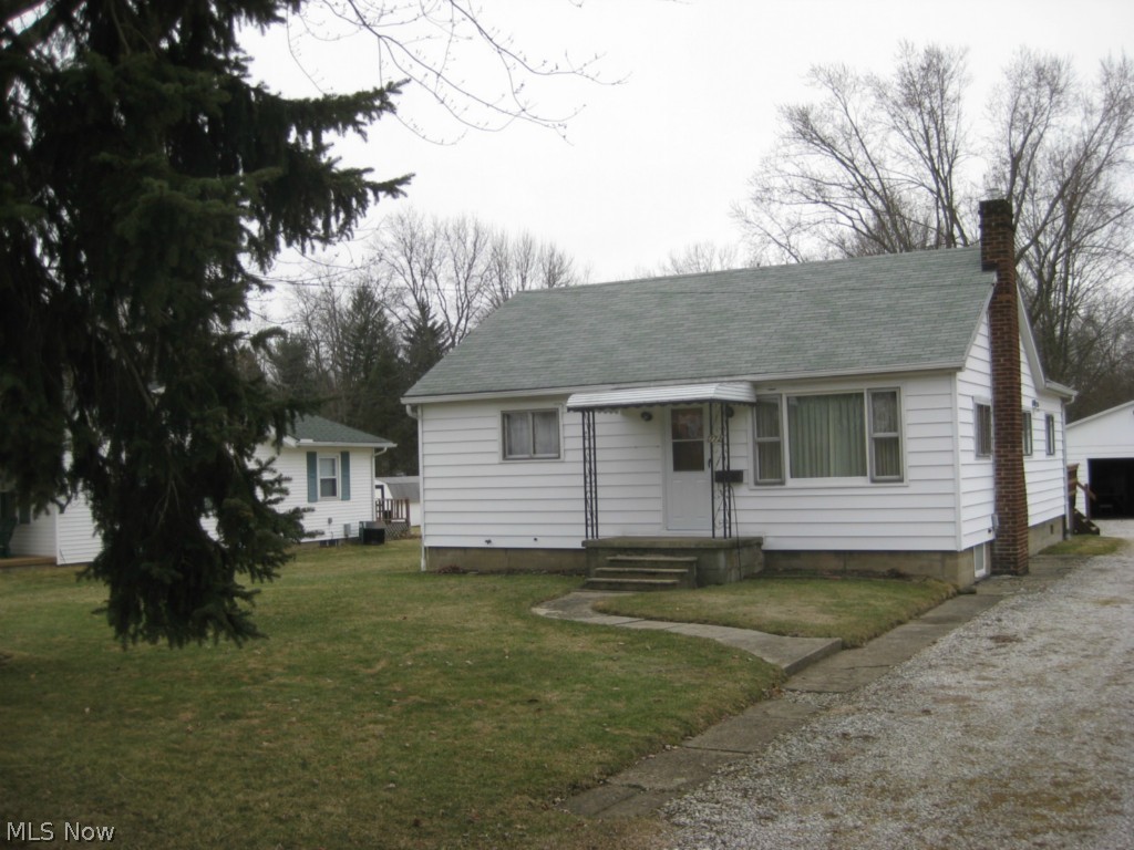 NICE & WELL MAINTAINED RANCH on the east side of Barberton near the hospital & Tuscora Park.  This home features hardwood floors in the living room and both BR.  The house sits on almost 1/2 acre lot and has a deck off the back of the house.  There is a 2 car garage for storage & your cars.  A new furnace high efficiency was installed 2014 and the roof is about 5 yrs. old, house insulated 2 yrs. ago.