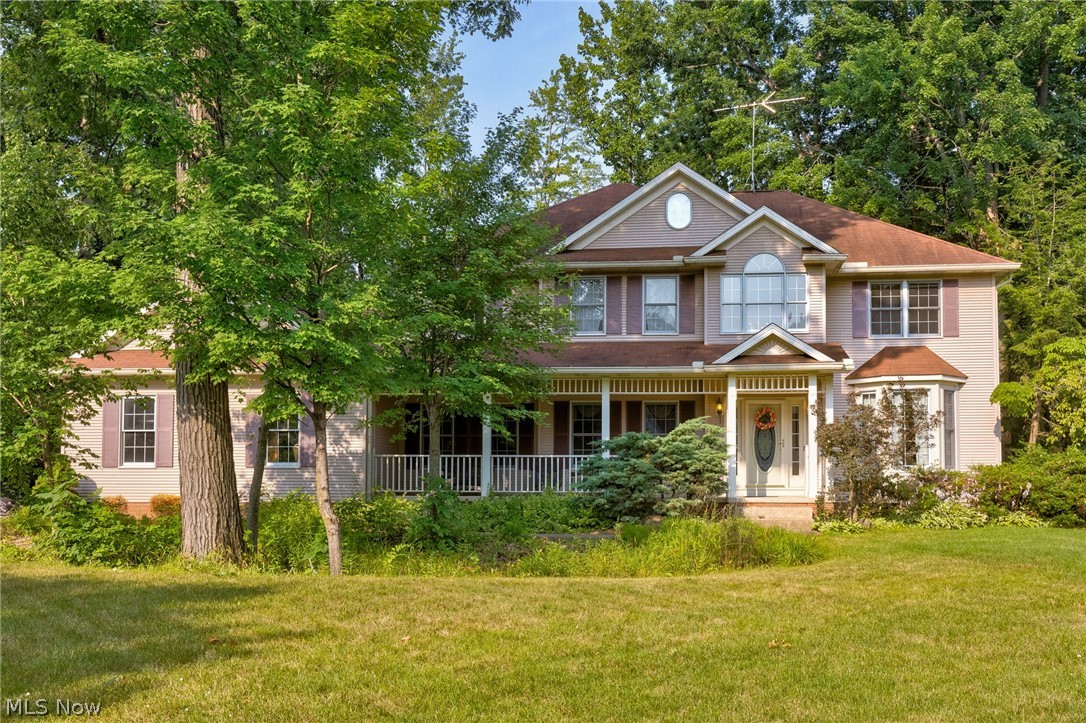 Welcome to 6506 Forestwood St. NW, Canton, OH 44718, where timeless elegance meets everyday comfort on over 1.25 beautifully landscaped acres surrounded by mature trees. Located in the highly desirable Jackson Local School District, this exceptional property offers the perfect blend of space, comfort, and convenience. 

Step inside to a stunning chandelier that welcomes you into the home. To the right, the inviting family room features a cozy fireplace, making it the perfect place to greet guests or relax. Continue through to the spacious living room, where abundant natural light pours in and a second fireplace creates a warm, inviting atmosphere. 

Just beyond the double doors, the kitchen offers ample space for cooking, entertaining, and everyday dining with eat-in possibilities. The thoughtfully designed first floor also includes a full bathroom and a bedroom, ideal for guests, a home office, or flexible living. 

Upstairs, the expansive owner's suite serves as a private retreat with a large walk-in closet and an impressive en-suite bathroom featuring a soaking tub, separate shower, and an additional oversized walk-in closet for exceptional storage. Three additional bedrooms and another full bathroom complete the second floor. 

Outside, enjoy the beauty and privacy of the professionally landscaped 1.25+ acre lot, surrounded by mature trees. The attached three-car garage and spacious driveway provide plenty of parking and storage. 

Recent updates include the air conditioning, hot water tank, water softener, and fencing, offering added peace of mind. 

With 5 bedrooms, 3 full bathrooms, a thoughtfully designed layout, beautiful updates, and an incredible setting, this is a wonderful opportunity to own a home that truly has it all. Schedule your private showing today!