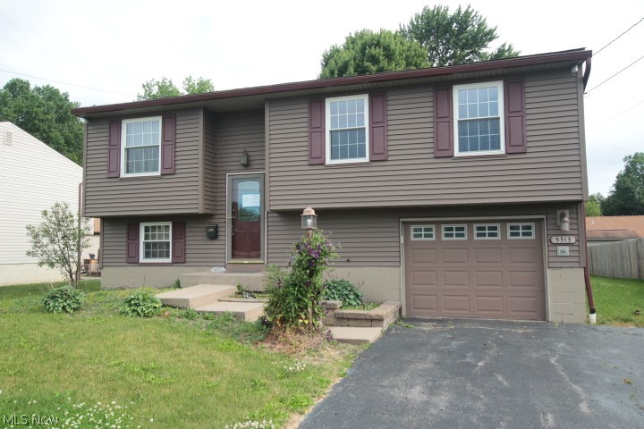 Nice bi-level in Austintown. 2BR 1.5BA home with eat-in kitchen that opens through sliding french doors to large elevated deck. Living room with neutral colors. Extra large master bedroom can easily be converted back to restore the home to a 3 bedroom. 2nd spacious bedroom and  bathroom complete the main level. Lower level features a family room with cozy corner gas fireplace, spacious powder room a pantry. Access to the garage. The exterior provides a beautiful yard  and a storage shed with 2 loft areas. "Property was built prior to 1978 and lead based paint potentially exits." This property may qualify for Seller Financing (Vendee).