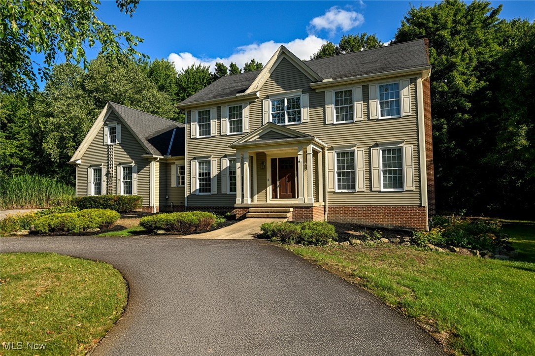Escape to your own private sanctuary on this stunning 1.55-acre wooded retreat! This thoughtfully designed four-bedroom, three-and-a-half-bathroom home offers nearly 2,800 square feet of comfortable living space that seamlessly blends the appeal of a classic home with the serenity of forest surroundings.

Step inside to discover beautiful hardwood floors that grace the welcoming foyer, elegant dining room, and well-appointed kitchen, creating a warm foundation throughout the main gathering spaces. The main floor features a traditional layout with a modern feel. You'll love the inviting breakfast room, the beautiful kitchen with walk in pantry and the spacious great room. The second floor features a primary bedroom suite alongside three additional bedrooms that can adapt to your family's changing needs.

The finished lower level expands your living area with daylight windows that keep the space bright and inviting. This versatile area includes a full bathroom and an additional room perfect as a bedroom, home office, or craft room. Whether you're working from home or hosting overnight guests, this space delivers flexibility with style.

Your three-car garage provides ample storage for vehicles, seasonal gear, and all those weekend project supplies. The wooded setting offers endless opportunities for outdoor enjoyment while maintaining the perfect balance of seclusion and accessibility.

Located within the highly regarded Aurora school district, this home positions your family for educational excellence. You'll appreciate the rural feel with easy access to shopping, schools, and all the wonderful Aurora amenities.

A HOME WARRANTY  is included for your peace of mind.

This property represents more than just a house – it's your gateway to a lifestyle where morning coffee comes with birdsong, evening walks meander through your own woodland paths, and the stresses of daily life naturally fade among the trees. Ready to make this wooded haven your forever home?
