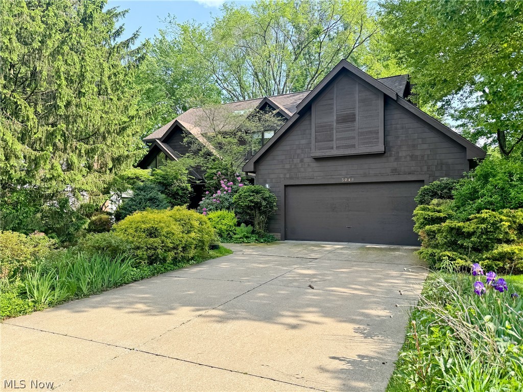 Welcome to 3048 Deercrest Path, where comfort, space, and a picturesque wooded backdrop come together in one of the area's most desirable neighborhoods. This beautifully maintained 4-bedroom home is tucked away on a quiet street, yet conveniently located within a mile of shopping, dining, and everyday amenities. A bike-hike trail entrance is in the adjacent neighborhood.  Step inside to discover an inviting floor plan filled with natural light and generous living spaces. The impressive high-ceiling family room creates a stunning gathering place, flowing seamlessly into the expansive 12' x 21' eat-in kitchen—the perfect setting for everything from busy weekday mornings to holiday celebrations. Enjoy family feasts in the dining room, relax in the bright living room, or close the doors to your main floor study/library and get some work done.  Unwind on the rear deck while enjoying the privacy and beauty of the wooded backyard, an ideal retreat for morning coffee or relaxing evenings. Upstairs, the spacious primary suite offers a peaceful escape with a private ensuite bath and abundant closet space. Three additional bedrooms provide plenty of room for family, guests, or a home office, all with walk-in closets.  The finished lower level features an enormous bonus room ready for game nights, movie marathons, or entertaining friends—with ample space for a pool table, recreation area, fitness equipment, or all three! And there's nearly 800 square feet of additional room in the basement for storage.  Offering exceptional space, meticulous care, and an unbeatable location, this move-in-ready home is a rare opportunity to enjoy the best of neighborhood living. Schedule your private showing today and see everything 3048 Deercrest Path has to offer!
