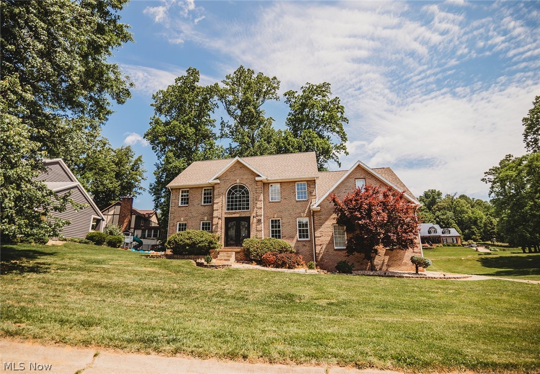 Stately brick home in the desirable Glenbrook subdivision offering exceptional space, style, and layout. This 4–5 bedroom, 3.5 bath home features a grand two-story foyer with sweeping staircase, formal living and dining rooms, and a large family room with fireplace open to the beautifully updated kitchen. The kitchen features marble-style counters and backsplashes, stainless steel appliances, double ovens, a commercial-style range hood, ample cabinetry, and extended pantry storage, making it ideal for cooking and entertaining.

Upstairs, you’ll find four bedrooms, including a spacious primary suite with an en-suite bath and walk-in closet. Another oversized bedroom also features a generous walk-in closet and could function as a second primary. The laundry is conveniently located on the bedroom level.

The finished walk-out basement provides outstanding flexibility with a large recreation room featuring a second fireplace, a full bath, and a bonus room that may serve as an additional bedroom, guest room, office, gym, or craft space.

Outdoor living is a highlight with multi-level decking, a privacy-fenced yard, a relaxing hot tub, and a beautiful stone outdoor fireplace. A screened porch adds even more usable space. This home even has a newer roof!

Additional features include a heated side-entry garage, neutral finishes, gas heat, and central air. Located near the gated Glenbrook entry on a low-traffic street, this impressive home offers size, function, and curb appeal in one of Vienna’s premier neighborhoods.