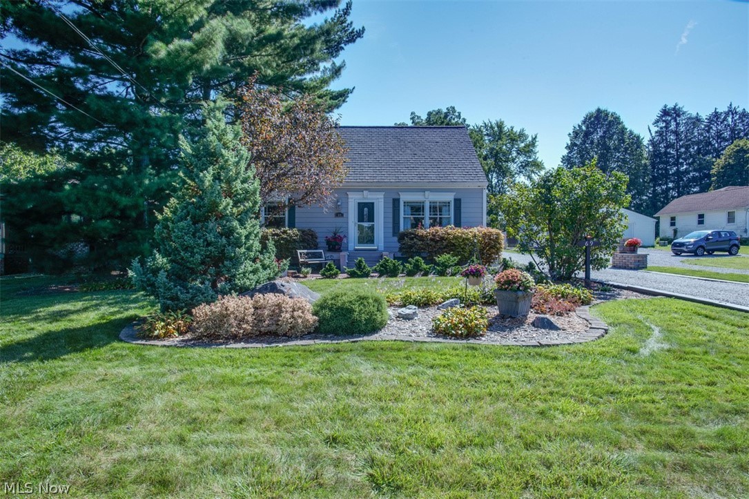 Wow!  Come check out this exceptionally well kept Cape Cod in Mogadore!  The home features 3 bedrooms and 2 full bathrooms and has nearly 2000 sq. feet of living space.  Upon entering, you will be greeted by the living room and fully renovated kitchen with quartz countertops.  Just off the kitchen is the great room addition with a cozy lower level conversation area that is perfect for entertaining.  This home is full of built-in storage and is loaded with updates including a new electric panel, updated decking and recently replaced Andersen windows throughout.  It also offers a 2 car attached garage and a full security system.  Located in Mogadore School District, this one will be gone fast!  Schedule your showing today!