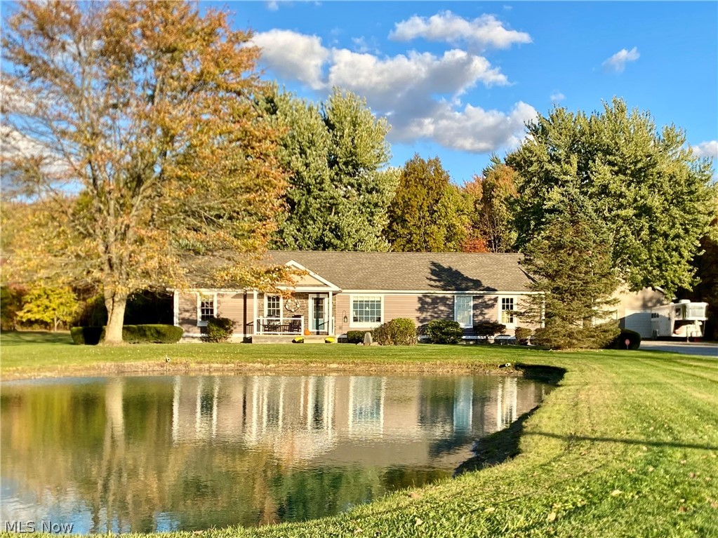 Welcome to peaceful country living in the desirable Maplewood School District! Situated on 2.28 acres with 200 feet of road frontage, this beautifully maintained 3-bedroom, 2 full bath ranch offers the perfect blend of comfort, functionality, and space. 
The open-concept layout features an updated kitchen with granite countertops, stone backsplash, and ample cabinetry, flowing seamlessly into the dining and living areas. A full finished basement provides additional living space perfect for entertaining, recreation, or a home gym. A 2-car attached garage adds convenience.

Major updates include new siding, entry and garage doors (2020), new covered patio (2017), and a brand-new furnace and A/C (2025), new Anderson windows (2020). The home is equipped with 400-amp service. Outdoors, enjoy your private pond and expansive yard, ideal for relaxing or entertaining. The 32x42 fully finished shop is a standout feature—complete with heat, water, and a half bath—perfect for hobbyists, car enthusiasts, small business owners, or extra storage. This property has been meticulously maintained and thoughtfully updated—move-in ready with room to grow.