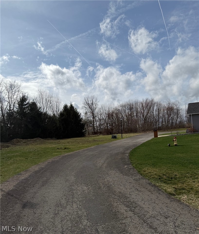 15-Year tax abatement opportunity! 
Builders & Developers – 21 Ready-to-Build Development Site 

This Ready-to-build parcel in the established Saxony Place Condominium Community, ideal for additional standalone condominium homes. Water, sewer, electric, and gas are already in place, allowing for immediate construction while reducing infrastructure costs.

Located within the City of Struthers CRA, qualifying new construction may receive a 15-Year, 100% property tax abatement on the improved value.

The HOA maintains common areas, landscaping, and snow removal, helping preserve neighborhood appeal and property values. Existing homes are detached condominium-style residences, making this parcel a natural extension of the community.