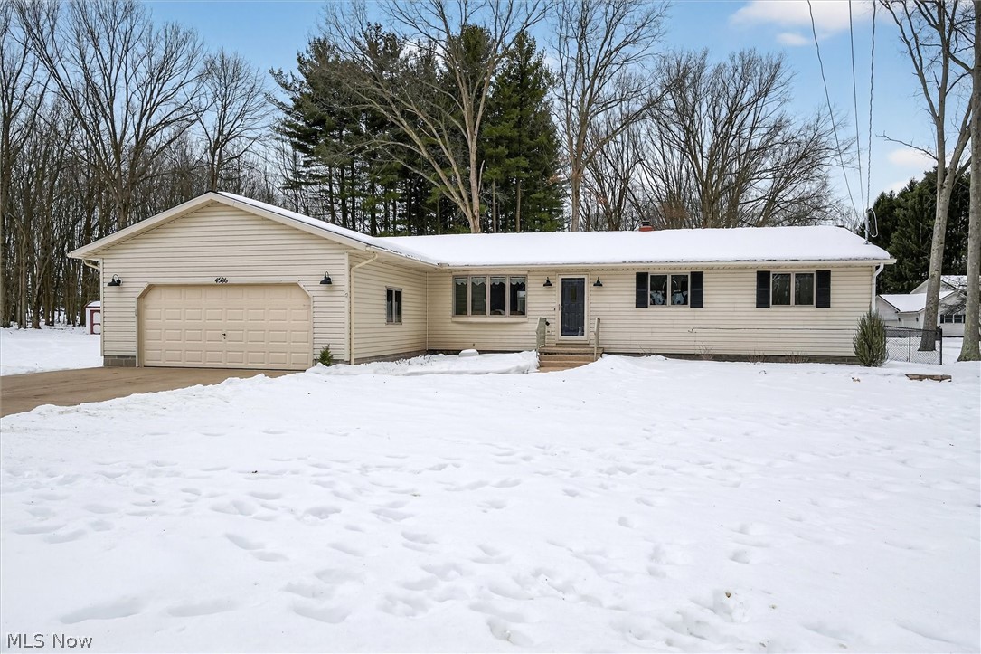 Beautifully updated and remodeled ranch situated on a cul-de-sac in Green School District. Home features Vinyl/LVT flooring throughout first level except 3 carpeted bedrooms. Living room features a bay window with open floor plan to eat-in kitchen/dining room. The kitchen offers Quartz counter tops, tile backsplash, stainless steel appliances, additional lighting, new garbage disposal, RO water and ample cabinets. The eat-in kitchen opens up to the 3 season room with sliding doors to enjoy the fresh air of your fenced in back yard. Additional Entertainment space is offered in the lower level carpeted 28 X 12 recreation room plus there is a bonus room with closet.  For car enthusiasts welcome to your 4 car tandem garage with electric, water, drains and 2 exterior doors.   Desire more space for storage of mower, tools, kayaks etc. welcome to your 20 X 14 custom constructed out building with garage door and a 20 X 6  covered porch all with electric. New chain link fenced back yard is perfect for kids to play in or pets to roam free all with access from the house or a rear double gate.  So many newer features such as: Quartz kitchen counters, lighting, septic system, shed, water softener, RO system, water holding tank, Carrier furnace, a/c, Leaf Guard Gutters, 200 amp electric panel, battery backup sump pump, Radon Mitigation system, landscape and more.  Truly a beautiful move in ready home for one who desires a secluded location with plenty of visiting wildlife all within Green Local School District. Be sure to view the floor plans in the supplements to see how well this house flows.   Oh yes, Old Republic Home Warranty included for peace of mind.