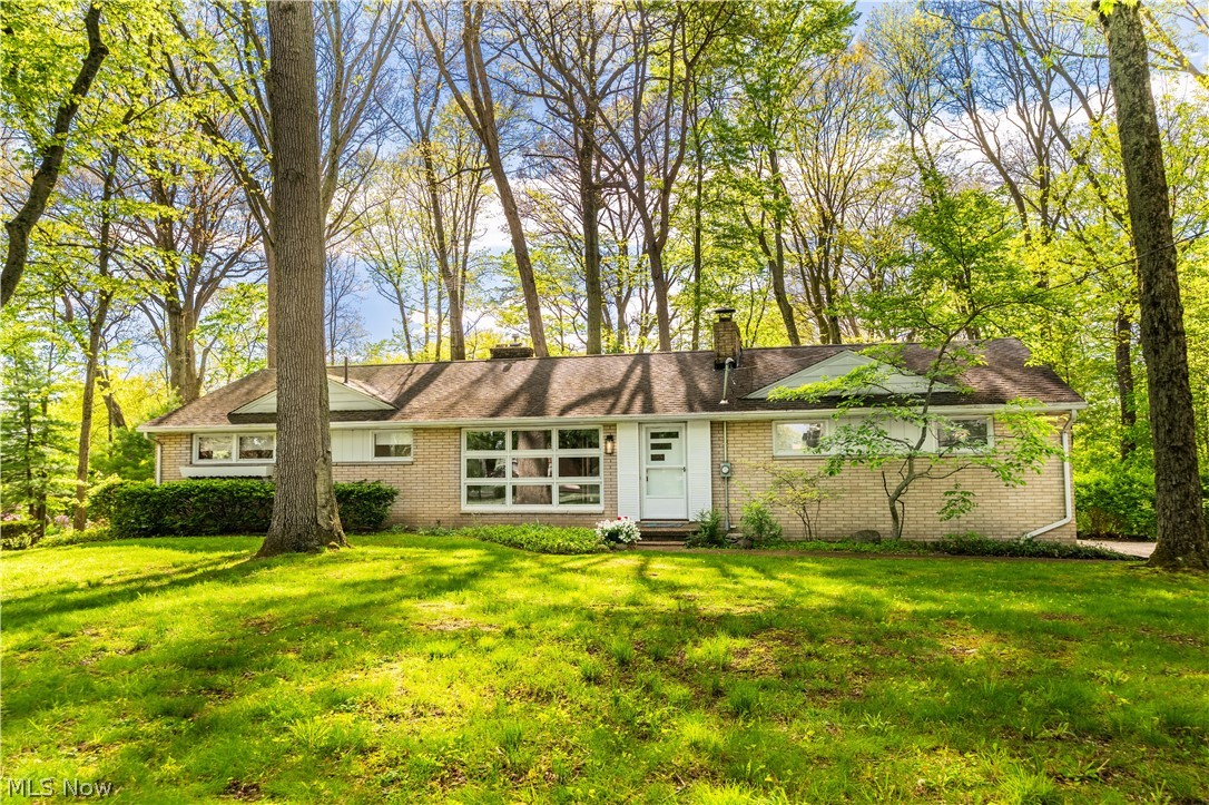 Nestled on a stunning nearly one-acre double wooded lot in Perry Township, this charming brick ranch offers the perfect blend of timeless character, warmth, and privacy. Surrounded by mature trees and peaceful scenery, this home feels like your own private retreat while still being conveniently located close to everything. Step inside to a spacious great room filled with abundant natural light, rich hardwood floors, and a cozy fireplace that creates an inviting atmosphere from the moment you enter. The open eat-in kitchen flows seamlessly into the breathtaking sunroom, which leads to a spacious back deck. This bright and airy space is wrapped in windows and highlighted by a second fireplace, making it the ultimate place to relax, unwind, or entertain while overlooking the serene backyard setting. Offering 3 spacious bedrooms and 1.5 bathrooms, this home provides comfortable living with endless possibilities. The fully finished basement features a dedicated laundry area, a half bath with a separate shower area and an expansive additional living space ideal for entertaining, a recreation room, a home office, or separate living quarters. Enjoy effortless indoor-outdoor living with multiple access points leading to the peaceful outdoor spaces. Completing the home is a spacious two-car garage with convenient basement access. From the picturesque wooded setting to the inviting interior and versatile living spaces, this exceptional property is truly one-of-a-kind. Schedule your showing today!