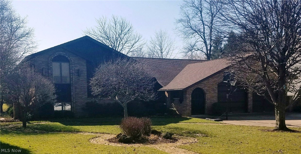 This Impressive brick beauty in Marlington is a true dream home! Custom built and all brick with 3 bedrooms and 2 1/2 baths with all the space you need for entertaining! From the inviting Nature Stone front entry to the lower level rec room, you'll be impressed by all this fabulous home boats! The kitchen features solid wood cabinetry, refrigerator in 2016, range & eating area with new laminate flooring which also extends into the dining room too!  Also on the main level is a living room & family room which has a fireplace, built in shelving and a slider to a nice patio! All three bedrooms are generous in size. The spacious master features bath with new flooring and all new fixtures, double closets & a slider to a private deck! Enjoy your morning coffee or evening sunsets here! Family & guests will be drawn to the amazing rec room! Whether they're sitting at the wet bar or in front of the gas fireplace with oak mantle, they'll feel right at home! Bar includes 2 refrigs, glass shelving