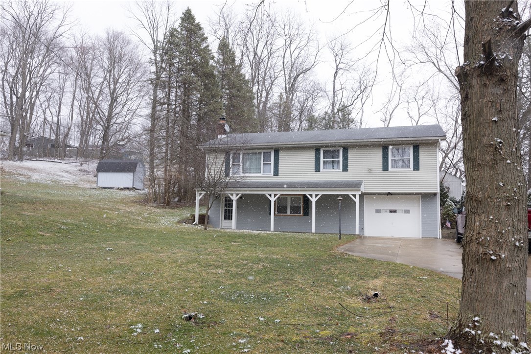 Looking for a spacious, well-maintained raised ranch in Akron, Ohio? Look no further than 4643 Timothy Dr! This beautiful home is situated on a large .76-acre lot in the highly sought-after Green School District. Inside, you'll find hardwood floors throughout the bedrooms and living room, creating a warm and inviting atmosphere. The lower level boasts a cozy wood-burning fireplace, perfect for relaxing on cold Ohio evenings. Additionally, there is a workshop and utility room located in the lower level, providing ample space for storage and hobbies. With a 1-car garage and plenty of yard space, this home offers all the convenience and comfort you need. Whether you're looking to relax in peace or spend quality time with loved ones, this home is the perfect choice. Don't miss your chance to make it yours - schedule a viewing today!