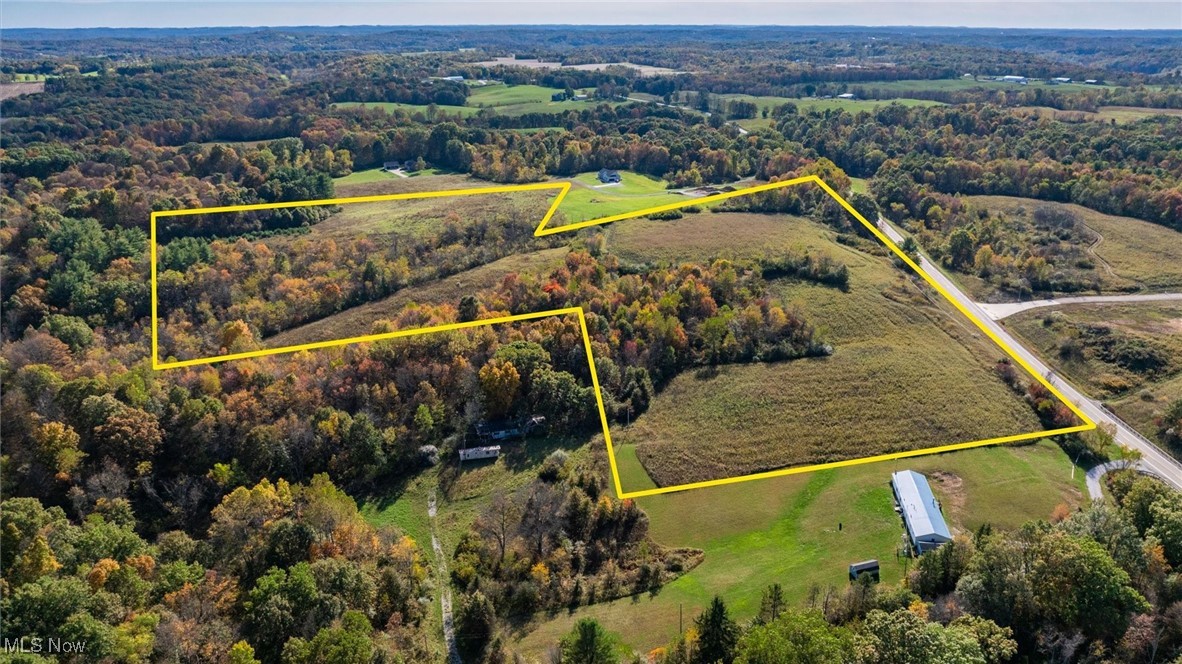 Discover a rare opportunity to develop over 33 acres of commercial land in a high-visibility, rapidly growing corridor. Ideally located just ½ mile from Interstate 70 and 6 miles from Interstate 77, this property offers exceptional connectivity and access—positioning your business or development project for success. With approximately 1,300 feet of road frontage, the site offers excellent visibility and accessibility for a wide range of commercial uses. The land is partially cleared and ready for development, with county water and electric utilities available at the road. This property provides regional access to multiple major markets, making it ideal for retail, industrial, logistics, healthcare, or mixed-use development with a strategic location of 35 miles to Wheeling WV, one hour to major cities such as Columbus, Canton and Marietta. This is a prime opportunity for developers and investors to secure a well-positioned property with significant upside potential.