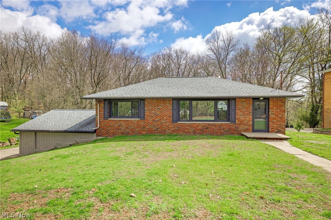 Welcome to this beautifully remodeled ranch home located near the desirable Portage Lakes area, offering convenient lake access and a peaceful, private setting on half an acre.

This charming brick and siding home has been completely updated with modern finishes throughout. Step inside to a spacious living area featuring built-in storage—perfect for both relaxing and entertaining. Brand-new luxury vinyl plank (LVP) flooring flows seamlessly throughout the lower level, kitchen and bathrooms, adding durability and style.

The fully renovated kitchen boasts all-new cabinetry, sleek countertops, and updated appliances, creating a fresh and functional space for cooking and gathering. The home includes three generously sized bedrooms with new carpet and two fully updated bathrooms, each thoughtfully designed with contemporary fixtures and finishes.

Enjoy outdoor living on the brand-new deck just off the back porch, overlooking a private, tree-lined yard that offers both space and serenity.

With its extensive renovations, modern upgrades, and prime location near Portage Lakes, this move-in-ready home is a rare find. Don’t miss your opportunity to enjoy lake living with the comfort of a completely updated home.