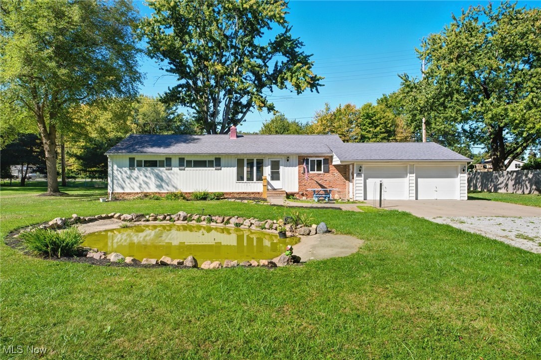 Welcome to 5479 E Heisley Rd in Mentor, a charming and well-maintained 3-bedroom, 1-bathroom home situated on a half acre lot, that’s move-in ready and filled with thoughtful updates. Step inside to find bright walls, rich wood flooring and trim, and a cozy family room anchored by a classic fireplace and a large window that floods the space with natural light. The spacious kitchen offers plenty of cabinetry, an inviting eating area, and comes equipped with a new oven and refrigerator (2025). The shared bathroom is roomy and functional, featuring dual sinks for added convenience. The spacious laundry room includes a utility tub, shelving and a pull down attic access hatch. This home has been carefully updated for peace of mind, including newer central air (2021), a new furnace (2025), and a roof (2008), along with fresh paint throughout. The attached 2-car garage features stairs and attic access, drywall, updated wiring, a painted floor, and a drive-through design for extra convenience. Outside, you’ll find ample curb appeal, two sheds, including an 8x16 shed with a new roof, cement flooring, and fresh interior paint and a 30x15 pond adding charm to the front yard.  With its cozy yet functional layout, spacious outdoor features, and close proximity to shopping, dining, and parks, 5479 E Heisley Rd is the perfect place to call home.