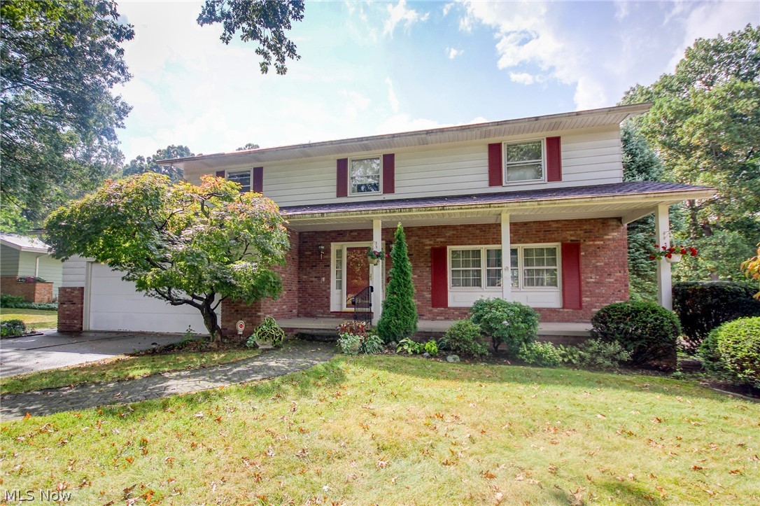 Welcome to 860 Shullo Drive. This 4 bedroom / 2.5 bath West Akron colonial has been well cared for by its one owner of 53 years and is ready for its next chapter. With 2386 square feet and a large unfinished basement there are countless possibilities for the second owner to make this home their own. Backing up to a wooded ravine that abuts the Sand Run Metro Park, this secluded gem features hardwood floors under the bedroom/family room carpet, a large master suite with full bath and three closets, an eat-in kitchen with writing desk, plenty of storage space, a cozy family room with a stone surround gas fireplace and built-ins, and a tranquil sunroom leading to a brick patio. Newer high efficiency furnace and AC unit. Washer/dryer, basement freezer, and all kitchen appliances stay.