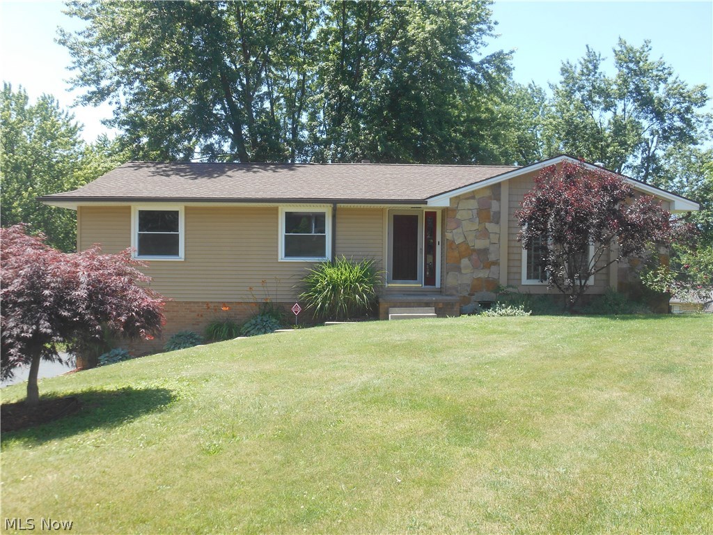 There is nothing to do here but just move in!  This super nice home is so beautifully presented.  Awesome kitchen with vaulted ceiling, tile back splash, wood flooring and new stainless steel appliances, spacious living room, three bedrooms including an owner's suite with full bath.  Large family room in the lower level has a wood burning stove and is a perfect area for family gatherings.  Fantastic cul-de-sac setting, great backyard, brick and vinyl exterior, walk out lower level, freshly painted throughout.  This one will sell fast!